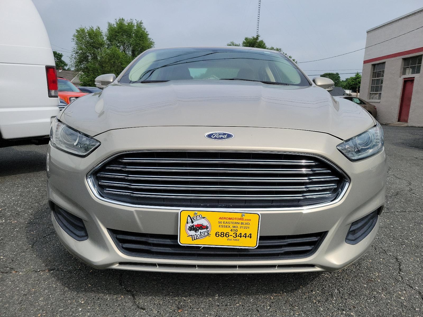 2015 Tectonic - HI /Dune - AQ Ford Fusion SE (3FA6P0H71FR) with an ENGINE: 2.5L IVCT engine, located at 50 Eastern Blvd., Essex, MD, 21221, (410) 686-3444, 39.304367, -76.484947 - Experience the sophisticated blend of performance, efficiency, and style found in this 2015 Ford Fusion SE 4dr sdn se fwd. Unmistakably eye-catching with a sleek Tectonic-hi exterior, it exudes refinement and ivct technology with its sturdy 2.5L engine. This impressive engine ensures smooth, respons - Photo #1