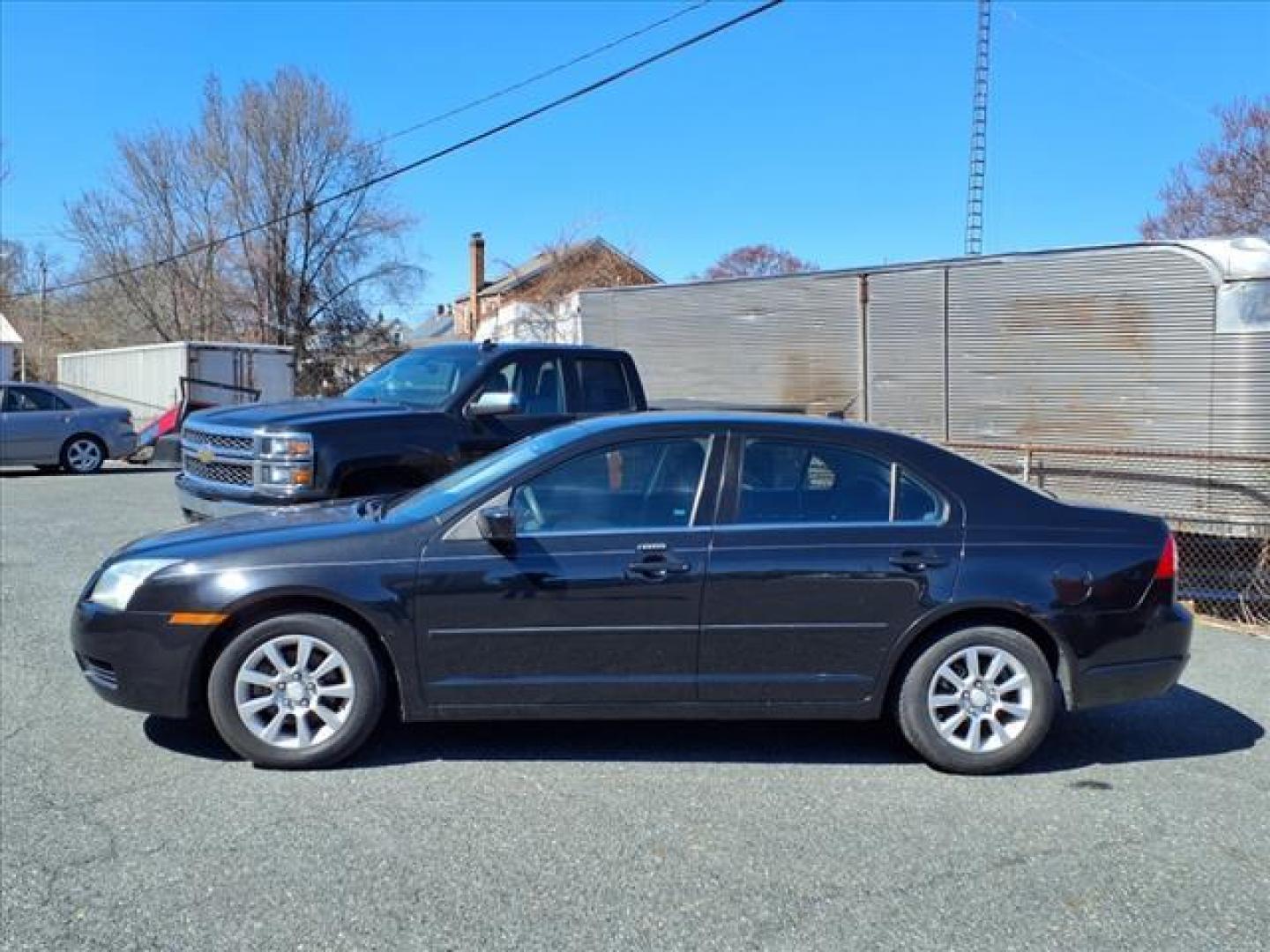 2009 Black Mercury Milan I-4 (3MEHM07Z39R) with an 2.3L 4 Cylinder Sequential-Port F.I. engine, Automatic transmission, located at 50 Eastern Blvd., Essex, MD, 21221, (410) 686-3444, 39.304367, -76.484947 - Photo#1