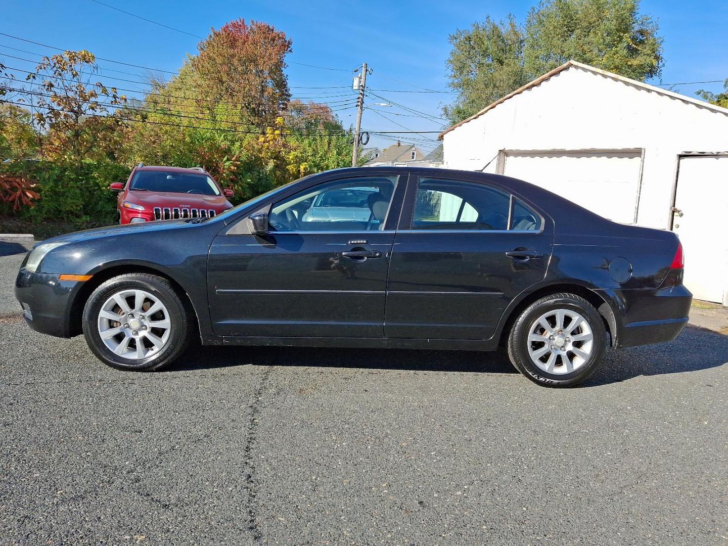2009 Black Mercury Milan I-4 (3MEHM07Z39R) with an 2.3L 4 Cylinder Sequential-Port F.I. engine, Automatic transmission, located at 50 Eastern Blvd., Essex, MD, 21221, (410) 686-3444, 39.304367, -76.484947 - Photo#26