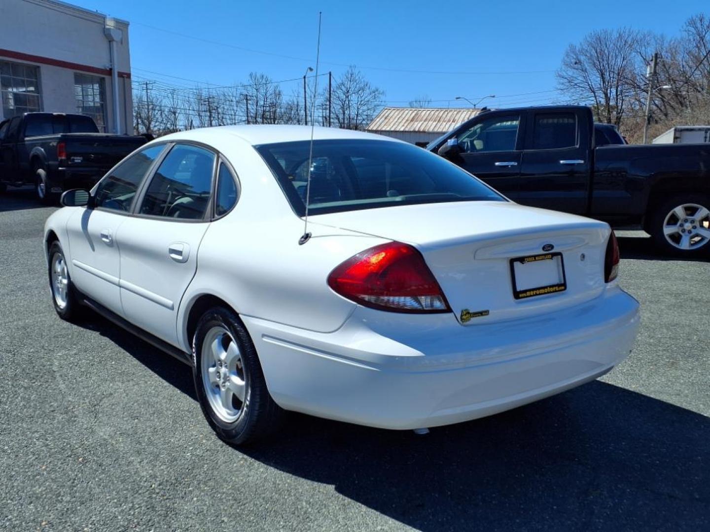 2004 White Ford Taurus SE (1FAFP53234G) with an 3.0L 6 Cylinder Fuel Injected engine, Automatic transmission, located at 50 Eastern Blvd., Essex, MD, 21221, (410) 686-3444, 39.304367, -76.484947 - Photo#2