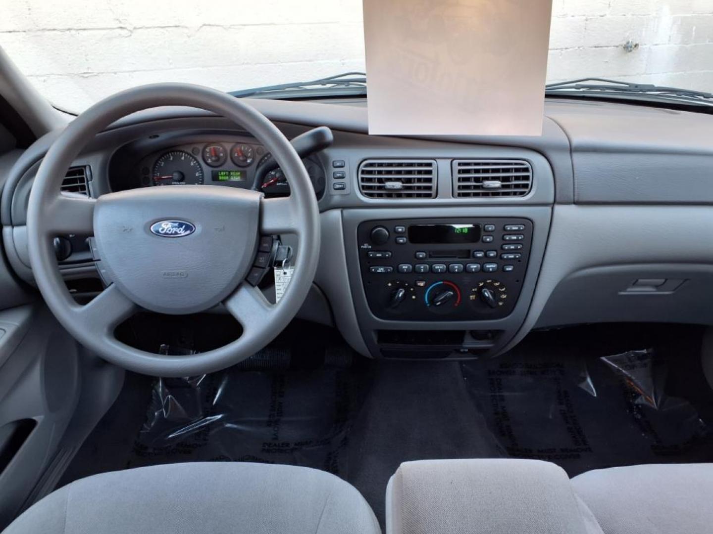 2004 White Ford Taurus SE (1FAFP53234G) with an 3.0L 6 Cylinder Fuel Injected engine, Automatic transmission, located at 50 Eastern Blvd., Essex, MD, 21221, (410) 686-3444, 39.304367, -76.484947 - Photo#13