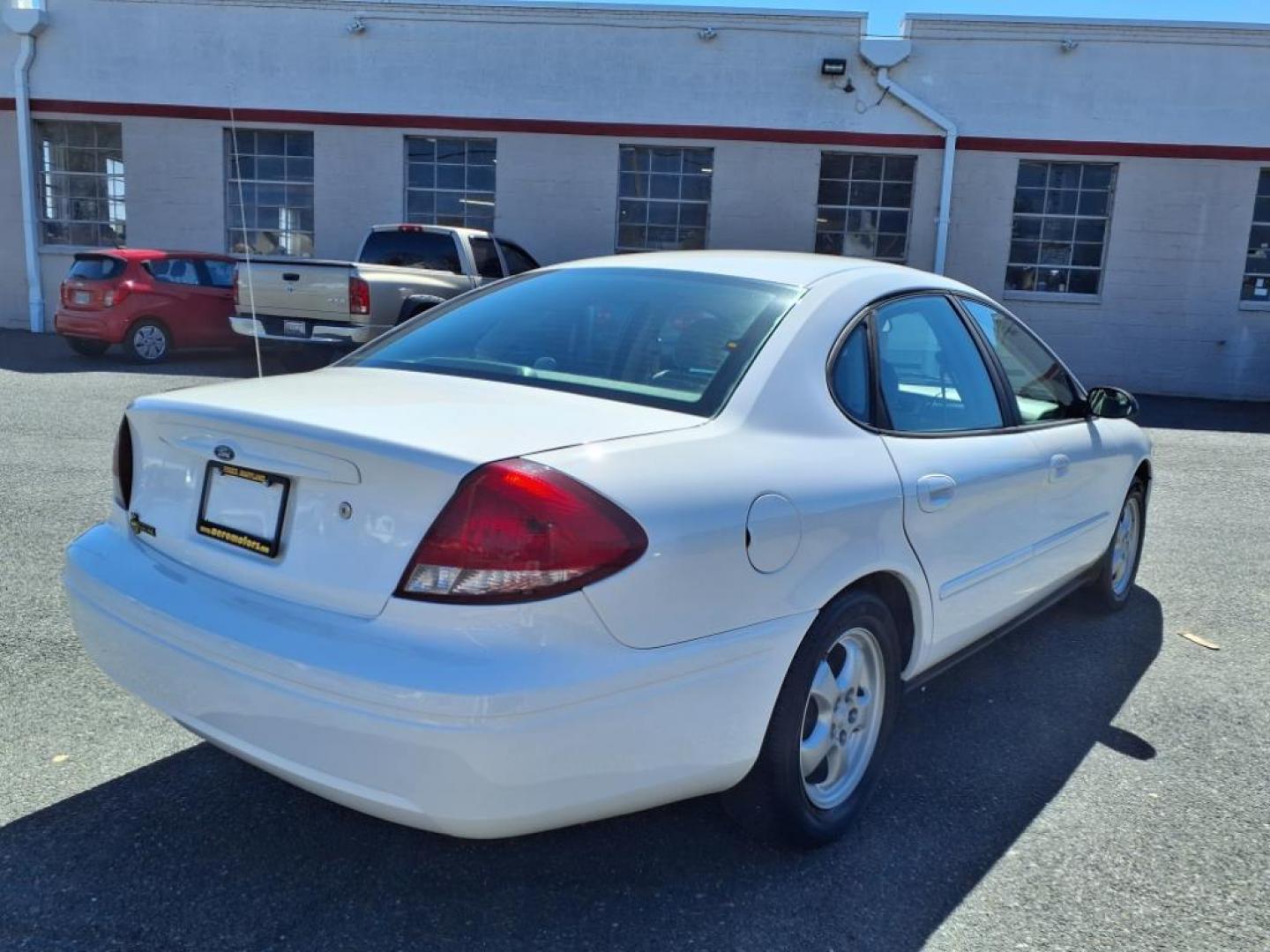 2004 White Ford Taurus SE (1FAFP53234G) with an 3.0L 6 Cylinder Fuel Injected engine, Automatic transmission, located at 50 Eastern Blvd., Essex, MD, 21221, (410) 686-3444, 39.304367, -76.484947 - Photo#4