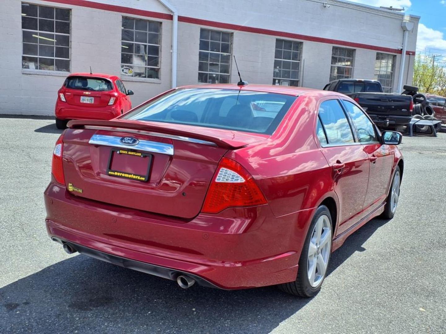 2010 Sangria Red Clearcoat Metallic Ford Fusion Sport (3FAHP0KC1AR) with an 3.5L 6 Cylinder Sequential-Port F.I. engine, Automatic transmission, located at 50 Eastern Blvd., Essex, MD, 21221, (410) 686-3444, 39.304367, -76.484947 - Photo#4