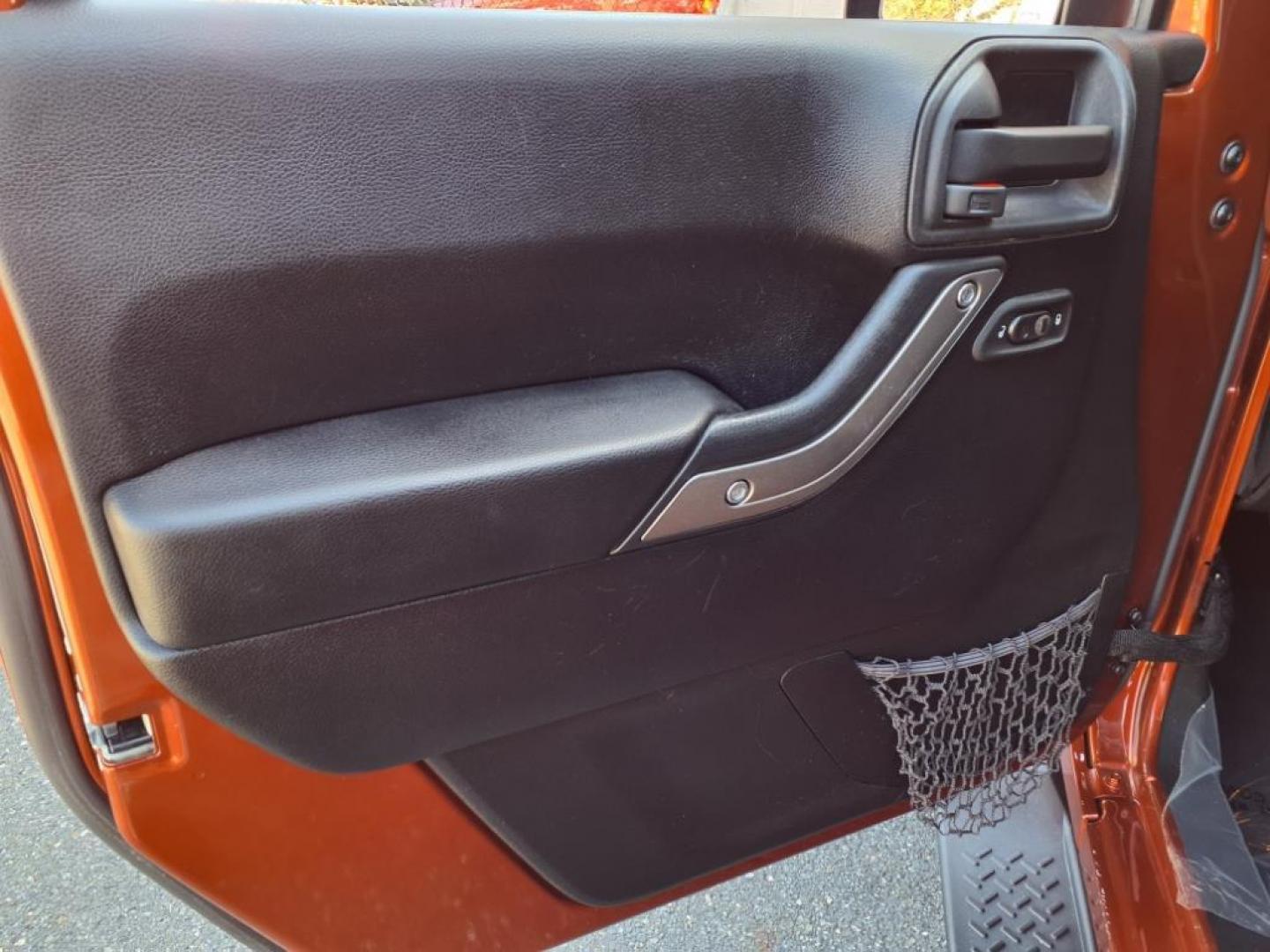 2014 Copperhead Pearl Coat Jeep Wrangler Unlimited Sport (1C4BJWDG4EL) with an 3.6L 6 Cylinder Sequential-Port F.I. engine, 5-Speed Automatic transmission, located at 50 Eastern Blvd., Essex, MD, 21221, (410) 686-3444, 39.304367, -76.484947 - Photo#9