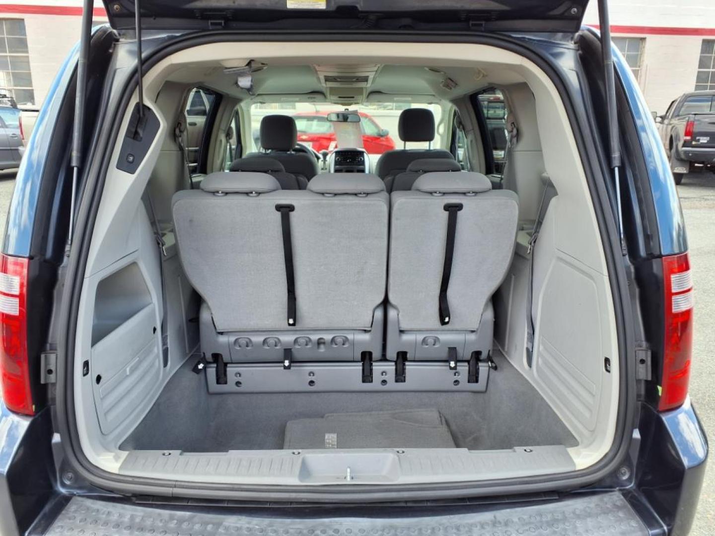 2008 Modern Blue Pearlcoat Dodge Grand Caravan SXT (1D8HN54P88B) with an 3.8L 6 Cylinder Sequential-Port F.I. engine, Automatic transmission, located at 50 Eastern Blvd., Essex, MD, 21221, (410) 686-3444, 39.304367, -76.484947 - Photo#4