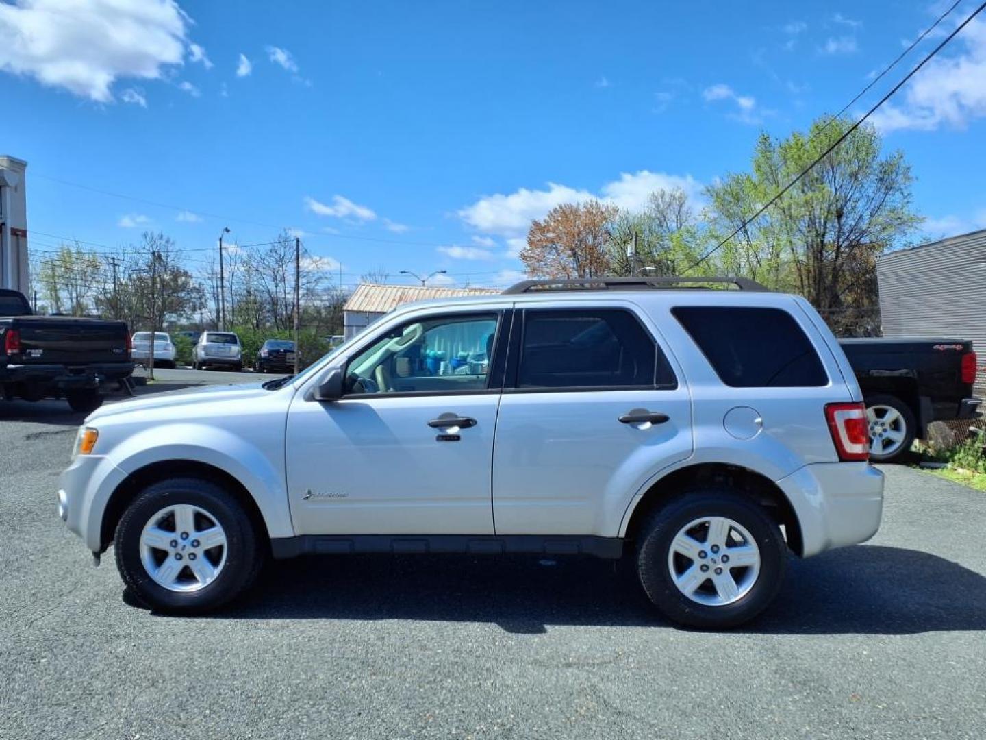 2011 Ingot Silver Metallic Ford Escape Hybrid Base (1FMCU5K30BK) with an 2.5L 2.5L Hybrid I4 153hp 136ft. lbs. Sequential-Port F.I. engine, CVT transmission, located at 50 Eastern Blvd., Essex, MD, 21221, (410) 686-3444, 39.304367, -76.484947 - Photo#1