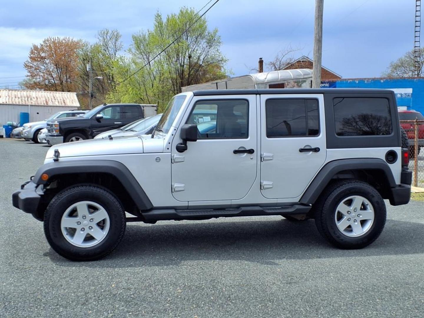 2011 Bright Silver Metallic Clear Coat Jeep Wrangler Unlimited Sport (1J4BA3H19BL) with an 3.8L 3.8L V6 202hp 237ft. lbs. Sequential-Port F.I. engine, 6-Speed Manual transmission, located at 50 Eastern Blvd., Essex, MD, 21221, (410) 686-3444, 39.304367, -76.484947 - Photo#1