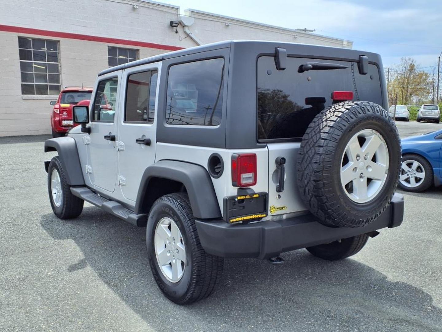2011 Bright Silver Metallic Clear Coat Jeep Wrangler Unlimited Sport (1J4BA3H19BL) with an 3.8L 3.8L V6 202hp 237ft. lbs. Sequential-Port F.I. engine, 6-Speed Manual transmission, located at 50 Eastern Blvd., Essex, MD, 21221, (410) 686-3444, 39.304367, -76.484947 - Photo#2