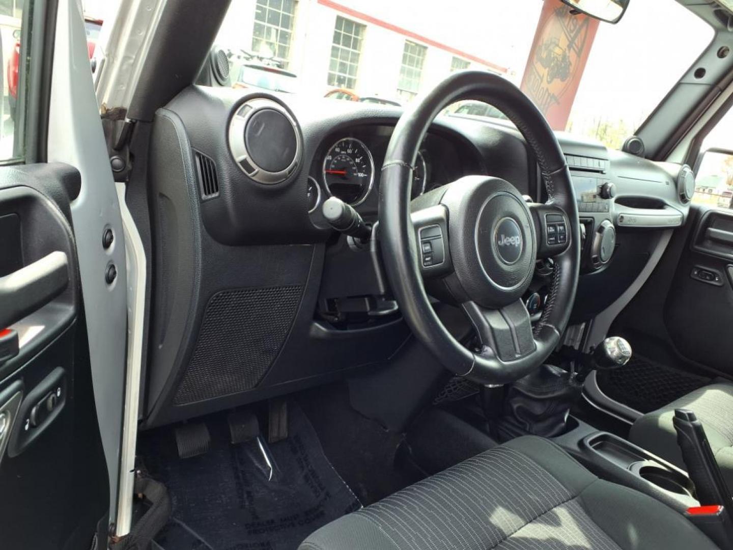 2011 Bright Silver Metallic Clear Coat Jeep Wrangler Unlimited Sport (1J4BA3H19BL) with an 3.8L 3.8L V6 202hp 237ft. lbs. Sequential-Port F.I. engine, 6-Speed Manual transmission, located at 50 Eastern Blvd., Essex, MD, 21221, (410) 686-3444, 39.304367, -76.484947 - Photo#11