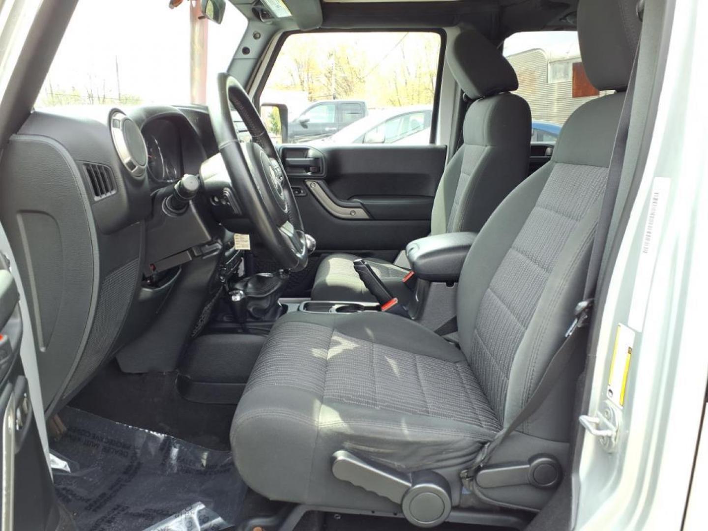 2011 Bright Silver Metallic Clear Coat Jeep Wrangler Unlimited Sport (1J4BA3H19BL) with an 3.8L 3.8L V6 202hp 237ft. lbs. Sequential-Port F.I. engine, 6-Speed Manual transmission, located at 50 Eastern Blvd., Essex, MD, 21221, (410) 686-3444, 39.304367, -76.484947 - Photo#12