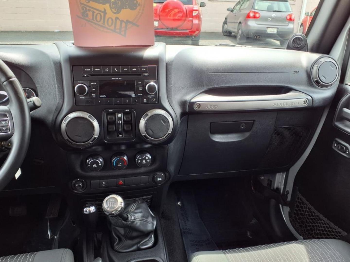2011 Bright Silver Metallic Clear Coat Jeep Wrangler Unlimited Sport (1J4BA3H19BL) with an 3.8L 3.8L V6 202hp 237ft. lbs. Sequential-Port F.I. engine, 6-Speed Manual transmission, located at 50 Eastern Blvd., Essex, MD, 21221, (410) 686-3444, 39.304367, -76.484947 - Photo#16