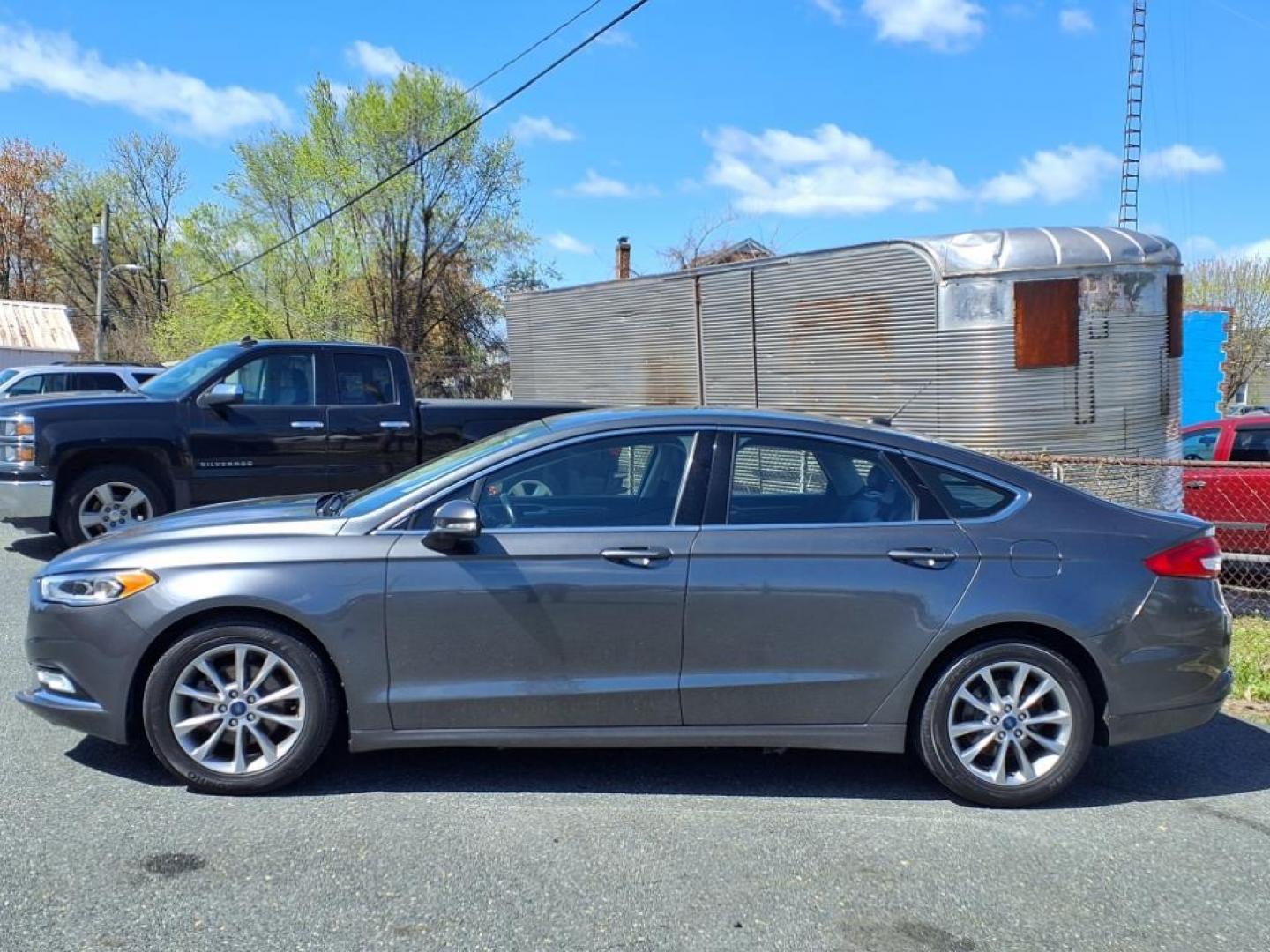 2017 Magnetic Ford Fusion SE (3FA6P0HD3HR) with an 1.5L 4 Cylinder Turbocharged engine, Automatic transmission, located at 50 Eastern Blvd., Essex, MD, 21221, (410) 686-3444, 39.304367, -76.484947 - Photo#1