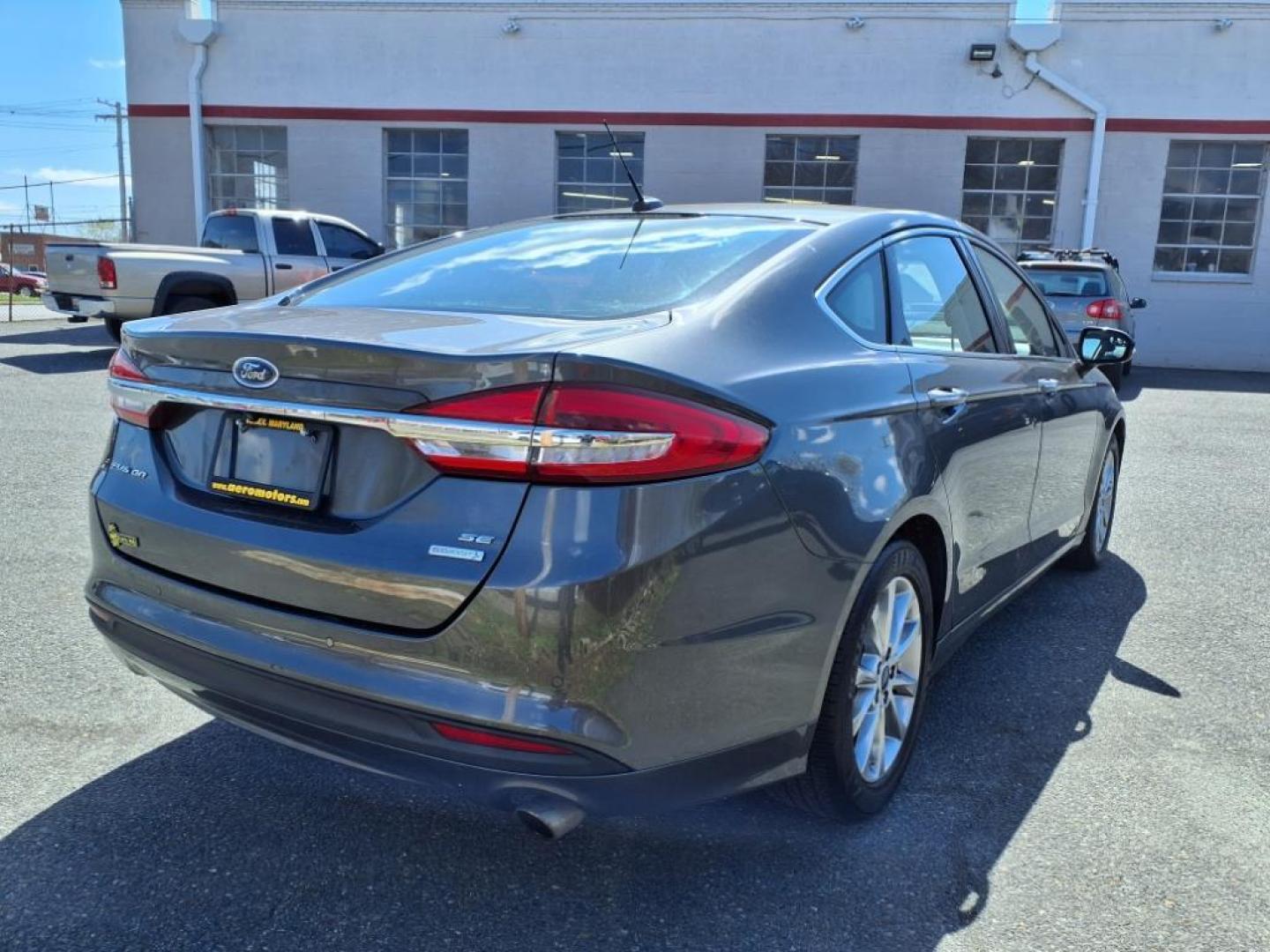 2017 Magnetic Ford Fusion SE (3FA6P0HD3HR) with an 1.5L 4 Cylinder Turbocharged engine, Automatic transmission, located at 50 Eastern Blvd., Essex, MD, 21221, (410) 686-3444, 39.304367, -76.484947 - Photo#4