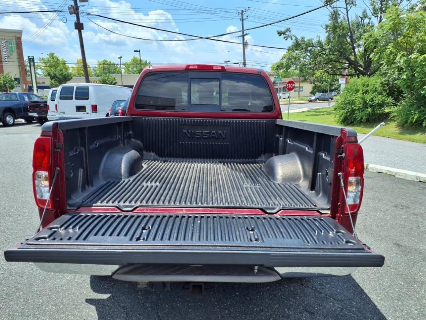 2008 Red Alert Nissan Frontier SE V6 (1N6AD06W08C) with an 4.0L 4.0L V6 261hp 281ft. lbs. Fuel Injected engine, 5-Speed Automatic transmission, located at 50 Eastern Blvd., Essex, MD, 21221, (410) 686-3444, 39.304367, -76.484947 - Photo#4