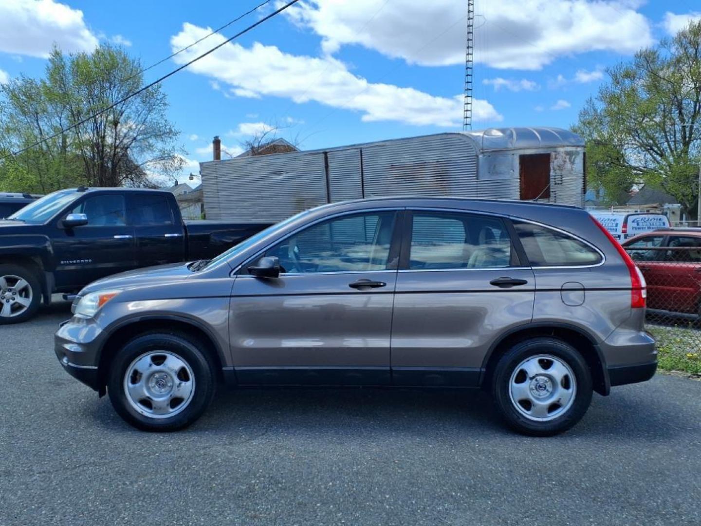 2010 Urban Titanium Metallic Honda CR-V LX (5J6RE3H30AL) with an 2.4L 4 Cylinder Sequential-Port F.I. engine, Automatic transmission, located at 50 Eastern Blvd., Essex, MD, 21221, (410) 686-3444, 39.304367, -76.484947 - Photo#1