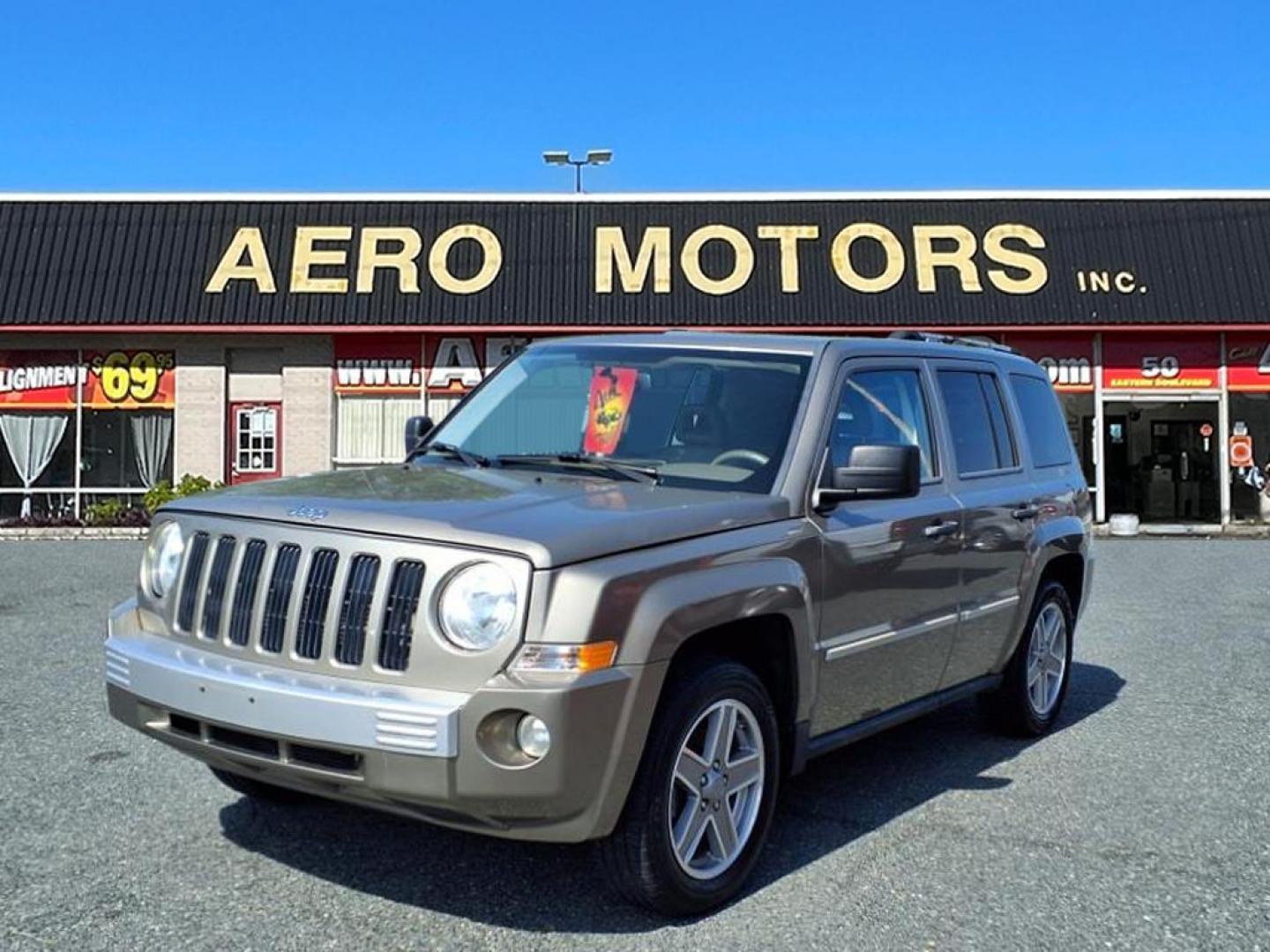 2008 Gold Jeep Patriot Limited (1J8FT48WX8D) with an 2.4L 4 Cylinder Sequential-Port F.I. engine, 4CYL transmission, located at 50 Eastern Blvd., Essex, MD, 21221, (410) 686-3444, 39.304367, -76.484947 - Photo#0