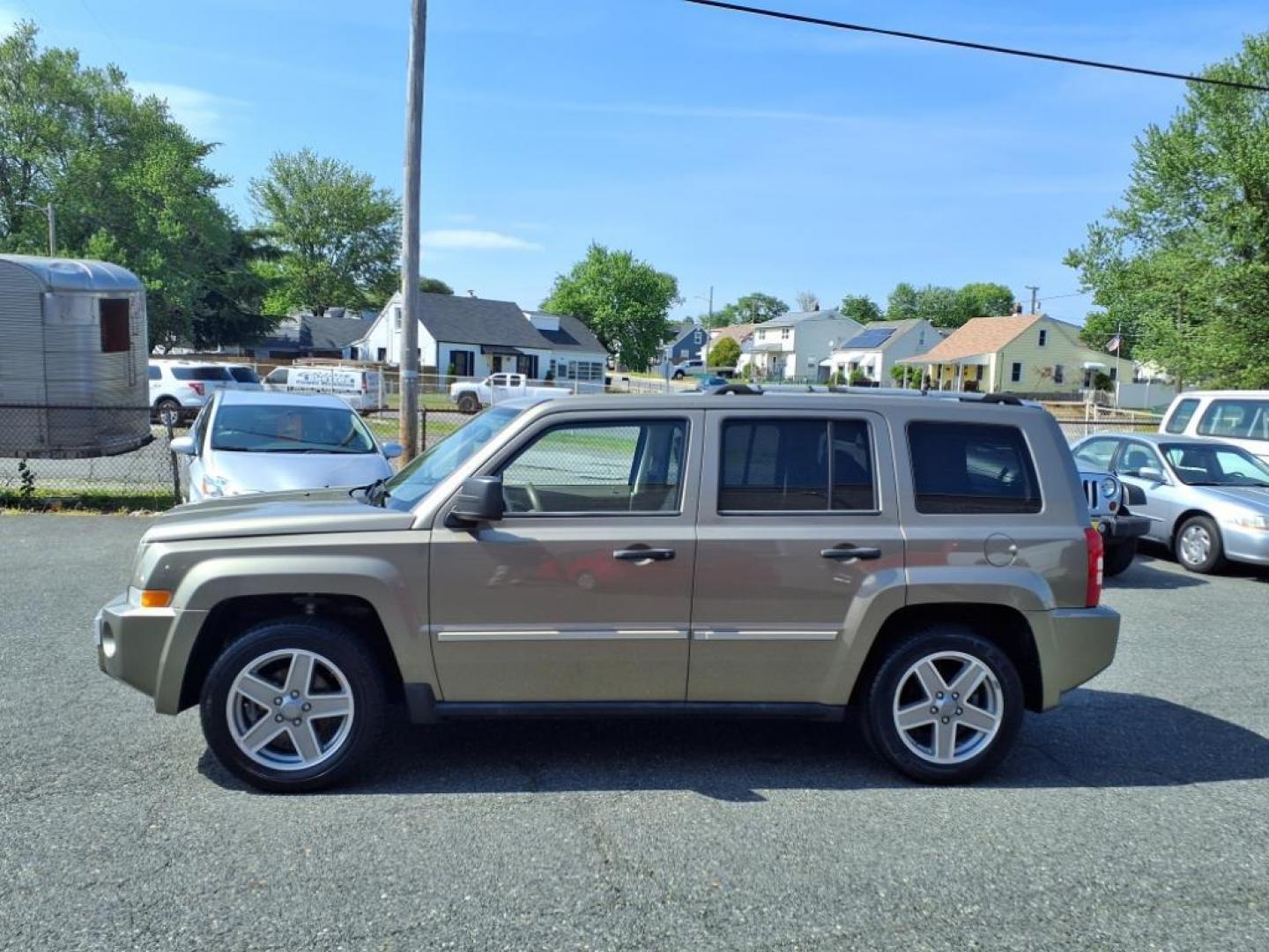 2008 Gold Jeep Patriot Limited (1J8FT48WX8D) with an 2.4L 4 Cylinder Sequential-Port F.I. engine, 4CYL transmission, located at 50 Eastern Blvd., Essex, MD, 21221, (410) 686-3444, 39.304367, -76.484947 - Photo#1