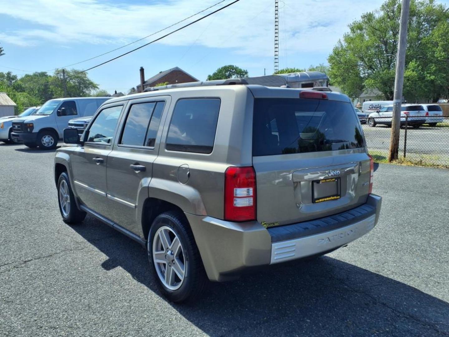 2008 Gold Jeep Patriot Limited (1J8FT48WX8D) with an 2.4L 4 Cylinder Sequential-Port F.I. engine, 4CYL transmission, located at 50 Eastern Blvd., Essex, MD, 21221, (410) 686-3444, 39.304367, -76.484947 - Photo#2