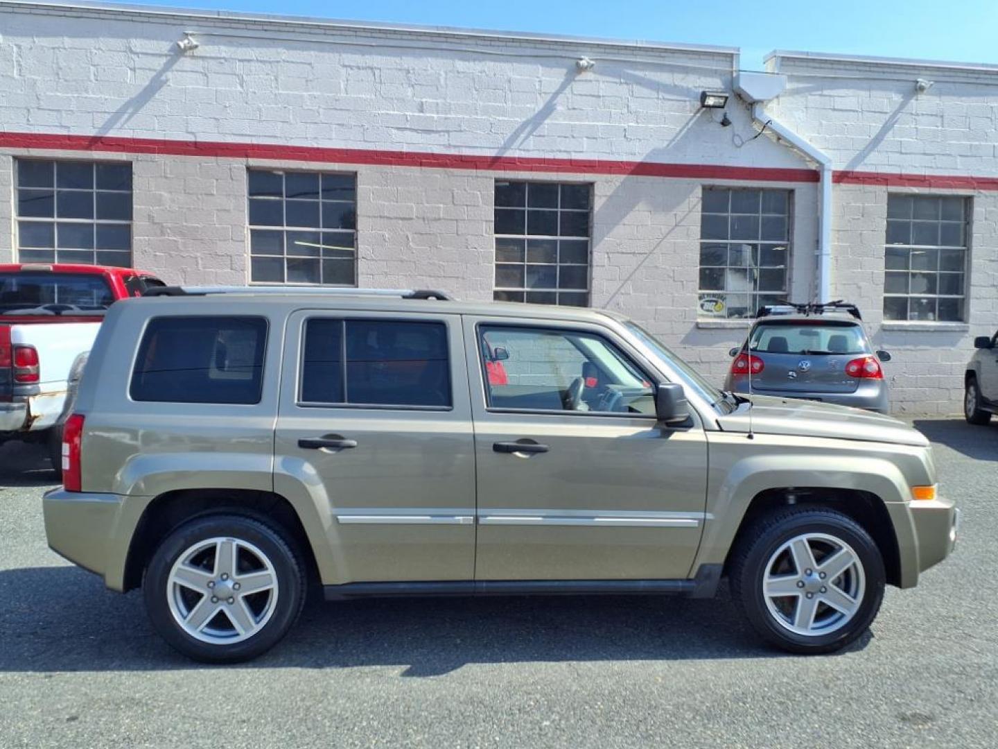 2008 Gold Jeep Patriot Limited (1J8FT48WX8D) with an 2.4L 4 Cylinder Sequential-Port F.I. engine, 4CYL transmission, located at 50 Eastern Blvd., Essex, MD, 21221, (410) 686-3444, 39.304367, -76.484947 - Photo#6