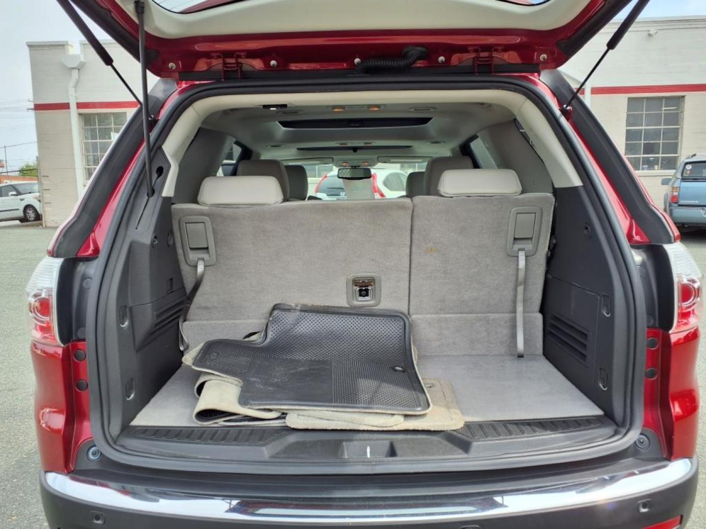 2012 Red GMC Acadia SLT-1 (1GKKRREDXCJ) with an 3.6L 6 Cylinder Fuel Injected engine, Automatic transmission, located at 50 Eastern Blvd., Essex, MD, 21221, (410) 686-3444, 39.304367, -76.484947 - Photo#4