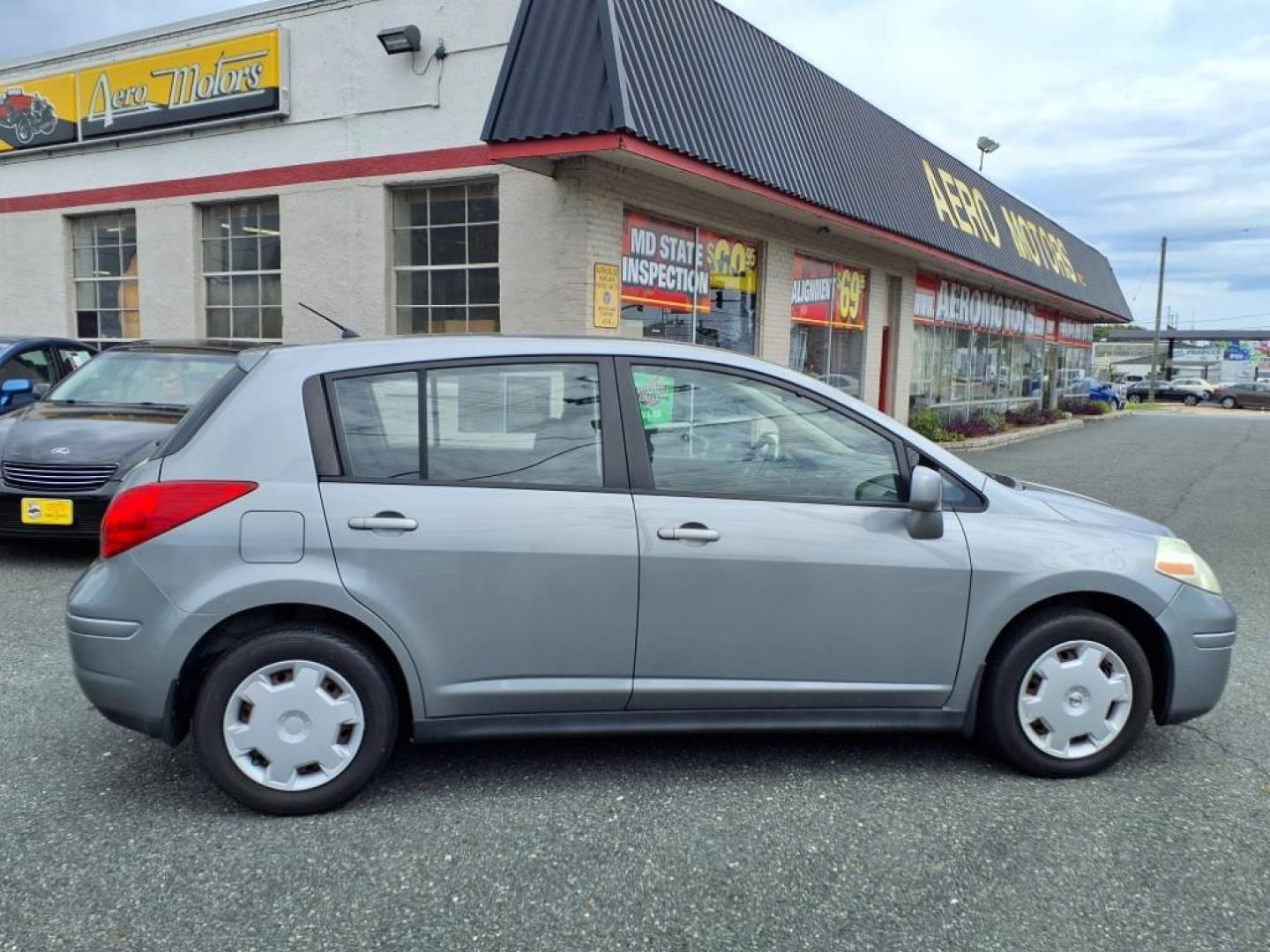 2009 Grey Nissan Versa (3N1BC13E39L) with an 1.8L 4 Cylinder Sequential-Port F.I. engine, Automatic transmission, located at 50 Eastern Blvd., Essex, MD, 21221, (410) 686-3444, 39.304367, -76.484947 - Photo#5