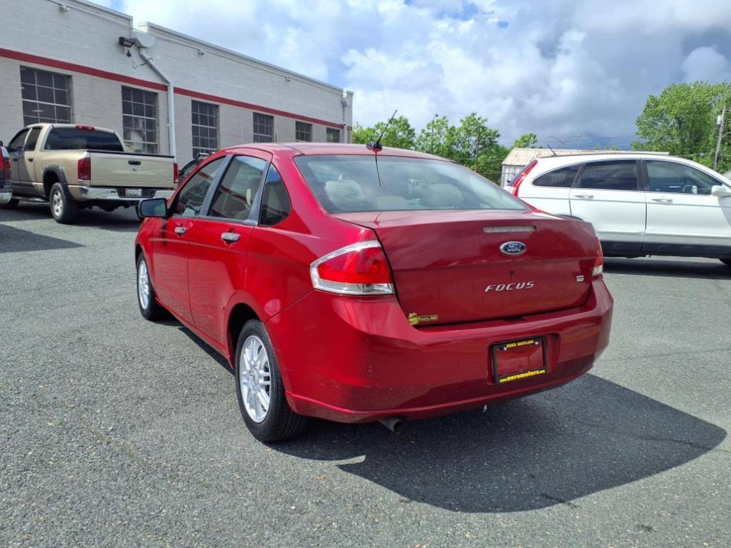 2009 Sangria Red Clearcoat Metallic Ford Focus SE (1FAHP35N89W) with an 2.0L 4 Cylinder Sequential-Port F.I. engine, 4CYL AT transmission, located at 50 Eastern Blvd., Essex, MD, 21221, (410) 686-3444, 39.304367, -76.484947 - Photo#1
