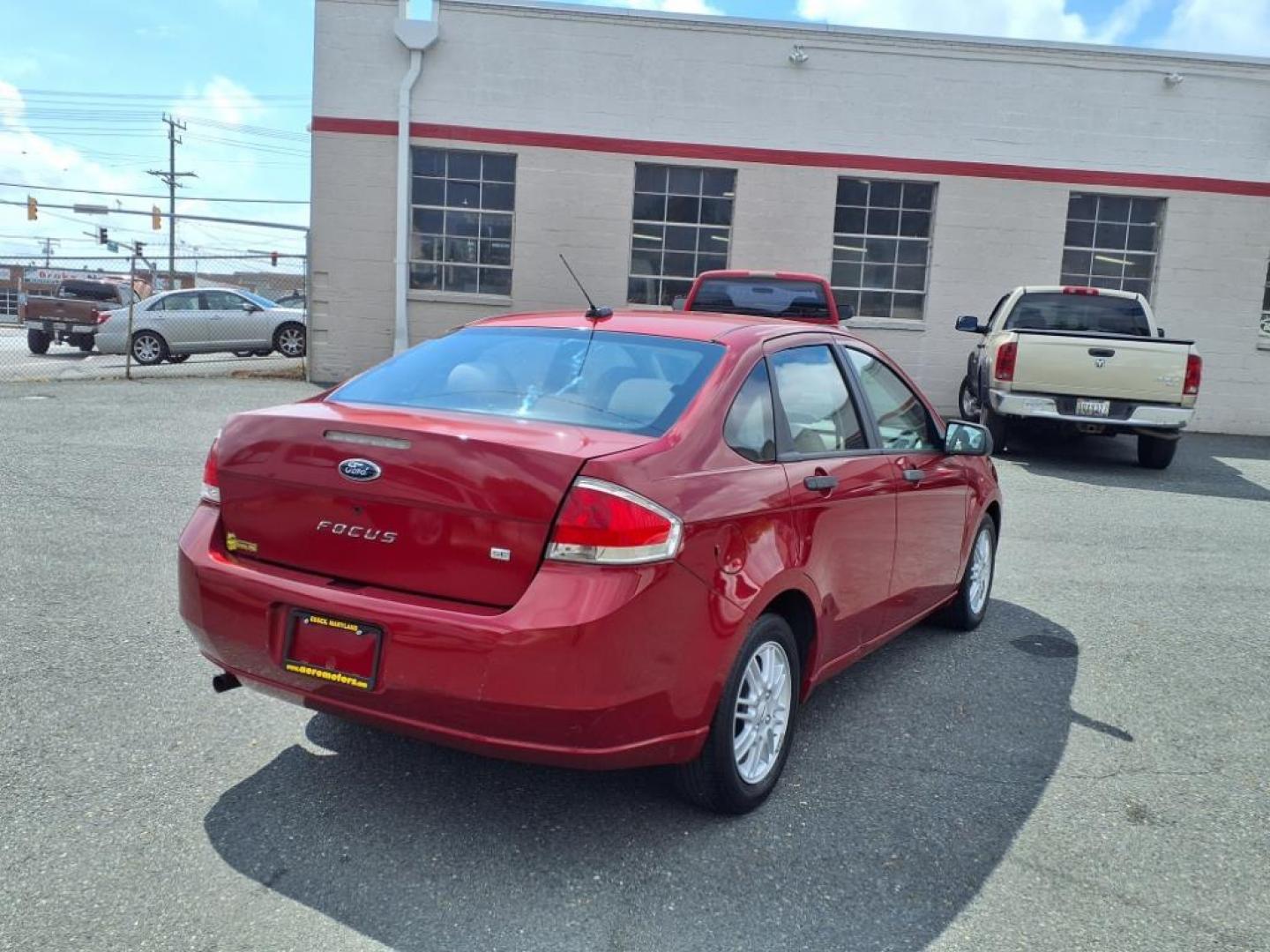2009 Sangria Red Clearcoat Metallic Ford Focus SE (1FAHP35N89W) with an 2.0L 4 Cylinder Sequential-Port F.I. engine, 4CYL AT transmission, located at 50 Eastern Blvd., Essex, MD, 21221, (410) 686-3444, 39.304367, -76.484947 - Photo#3