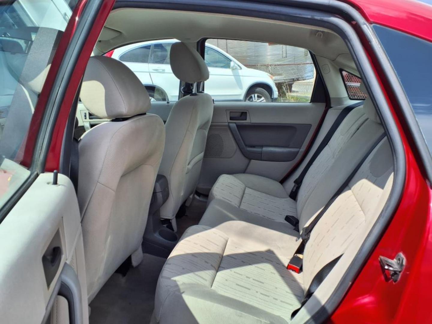 2009 Sangria Red Clearcoat Metallic Ford Focus SE (1FAHP35N89W) with an 2.0L 4 Cylinder Sequential-Port F.I. engine, 4CYL AT transmission, located at 50 Eastern Blvd., Essex, MD, 21221, (410) 686-3444, 39.304367, -76.484947 - Photo#11
