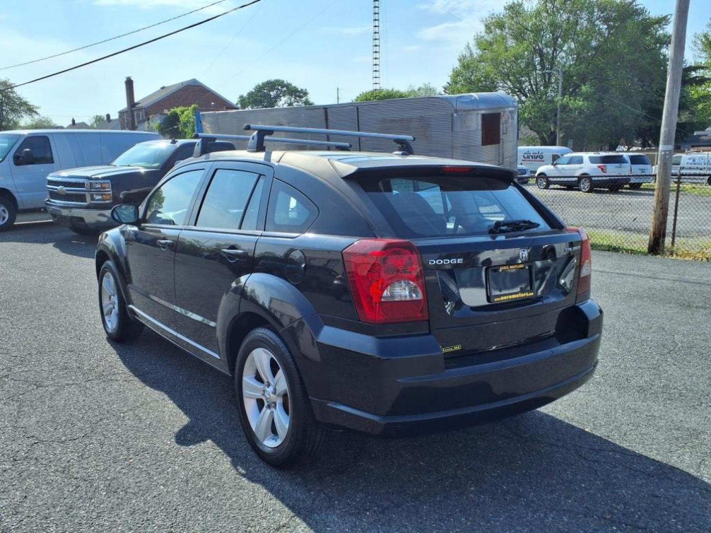 2011 Black Dodge Caliber Mainstreet (1B3CB3HAXBD) with an 2.0L 4 Cylinder Sequential-Port F.I. engine, 4CYL AT transmission, located at 50 Eastern Blvd., Essex, MD, 21221, (410) 686-3444, 39.304367, -76.484947 - Photo#2