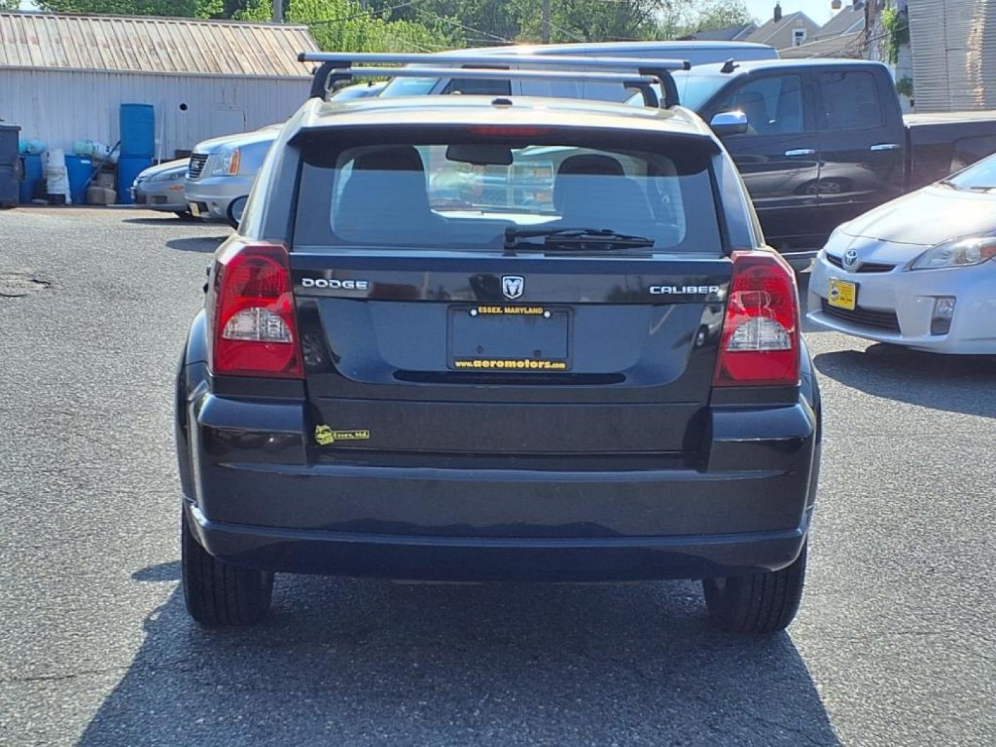 2011 Black Dodge Caliber Mainstreet (1B3CB3HAXBD) with an 2.0L 4 Cylinder Sequential-Port F.I. engine, 4CYL AT transmission, located at 50 Eastern Blvd., Essex, MD, 21221, (410) 686-3444, 39.304367, -76.484947 - Photo#3