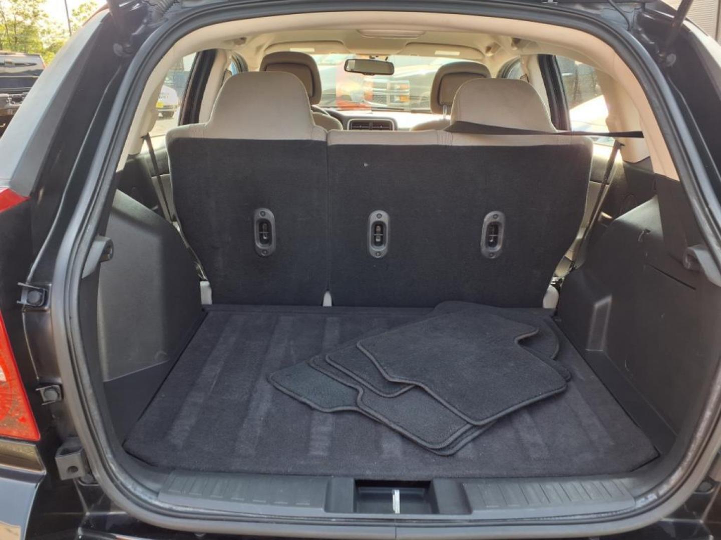 2011 Black Dodge Caliber Mainstreet (1B3CB3HAXBD) with an 2.0L 4 Cylinder Sequential-Port F.I. engine, 4CYL AT transmission, located at 50 Eastern Blvd., Essex, MD, 21221, (410) 686-3444, 39.304367, -76.484947 - Photo#4