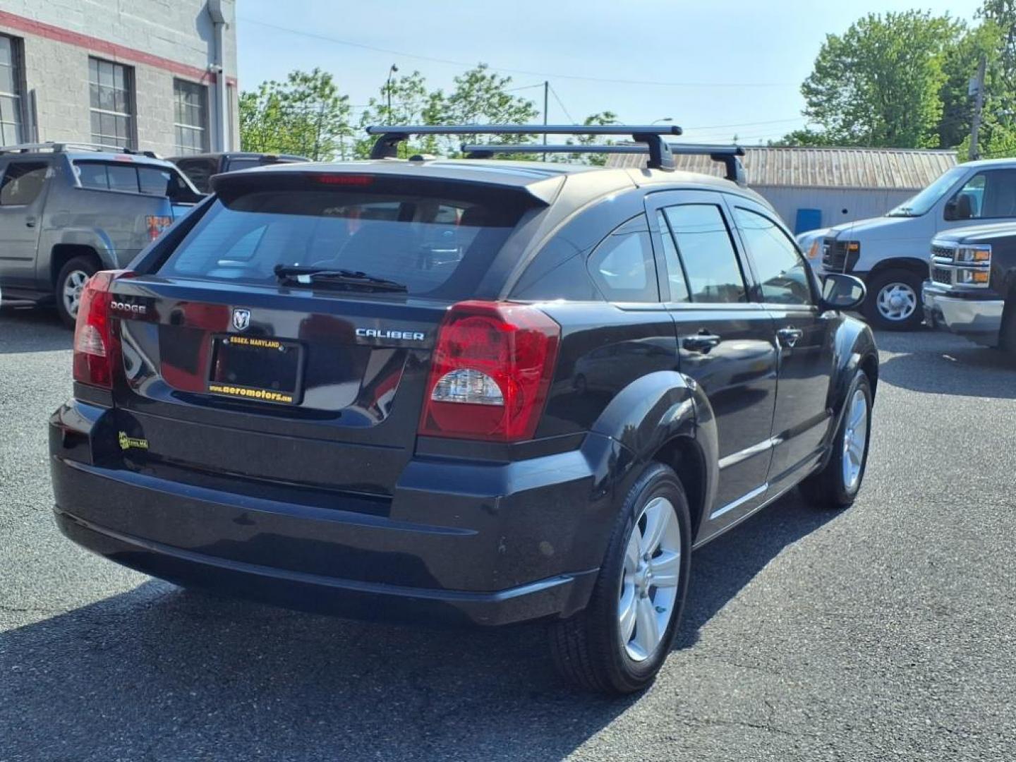 2011 Black Dodge Caliber Mainstreet (1B3CB3HAXBD) with an 2.0L 4 Cylinder Sequential-Port F.I. engine, 4CYL AT transmission, located at 50 Eastern Blvd., Essex, MD, 21221, (410) 686-3444, 39.304367, -76.484947 - Photo#5