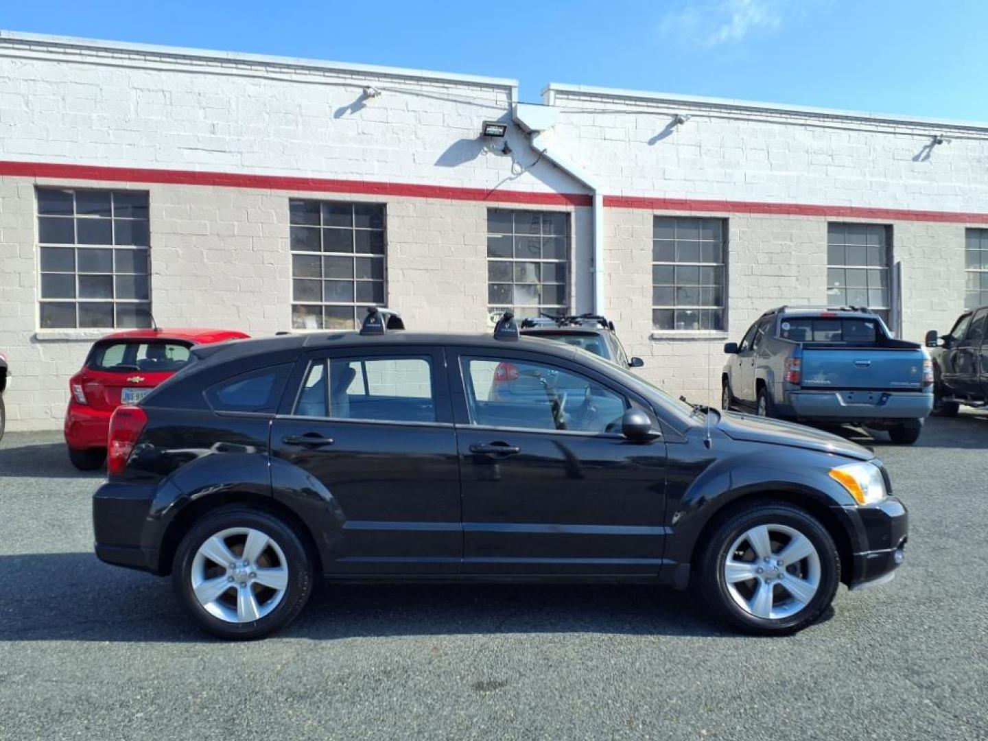 2011 Black Dodge Caliber Mainstreet (1B3CB3HAXBD) with an 2.0L 4 Cylinder Sequential-Port F.I. engine, 4CYL AT transmission, located at 50 Eastern Blvd., Essex, MD, 21221, (410) 686-3444, 39.304367, -76.484947 - Photo#6