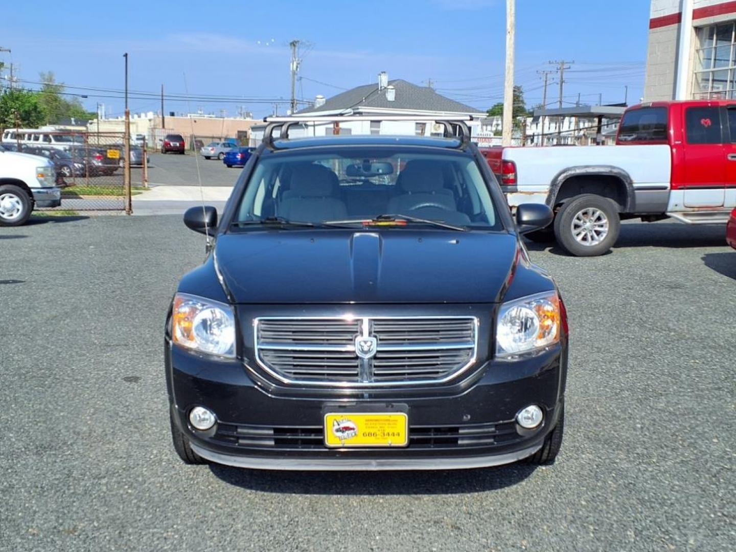 2011 Black Dodge Caliber Mainstreet (1B3CB3HAXBD) with an 2.0L 4 Cylinder Sequential-Port F.I. engine, 4CYL AT transmission, located at 50 Eastern Blvd., Essex, MD, 21221, (410) 686-3444, 39.304367, -76.484947 - Photo#7