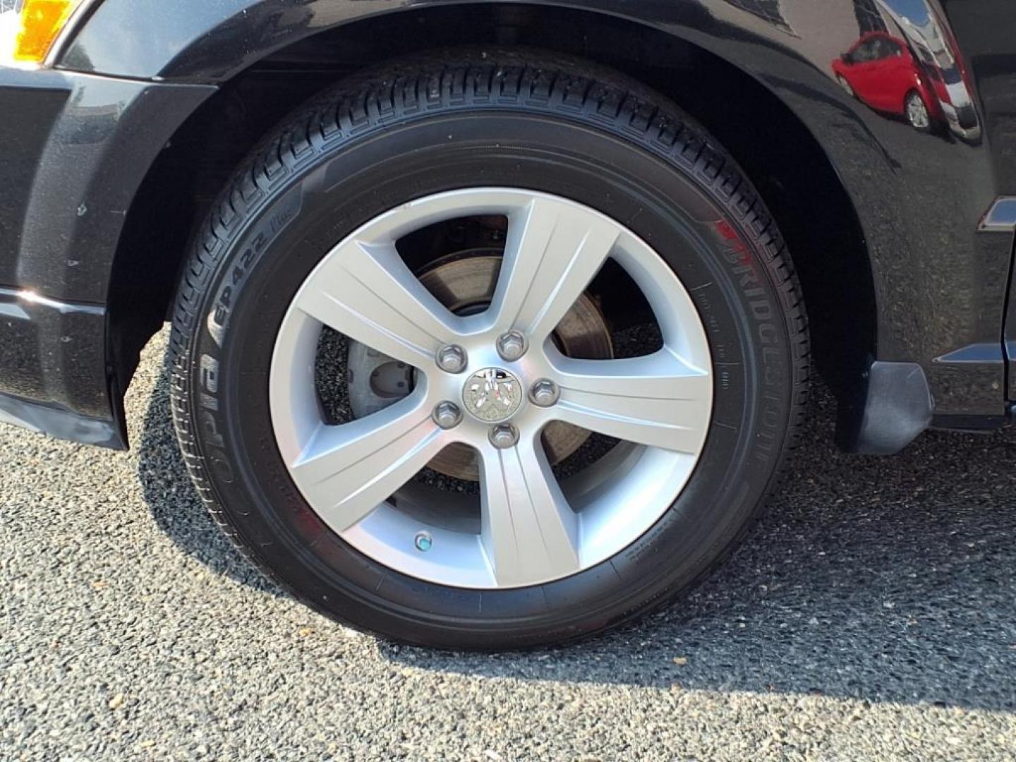 2011 Black Dodge Caliber Mainstreet (1B3CB3HAXBD) with an 2.0L 4 Cylinder Sequential-Port F.I. engine, 4CYL AT transmission, located at 50 Eastern Blvd., Essex, MD, 21221, (410) 686-3444, 39.304367, -76.484947 - Photo#8