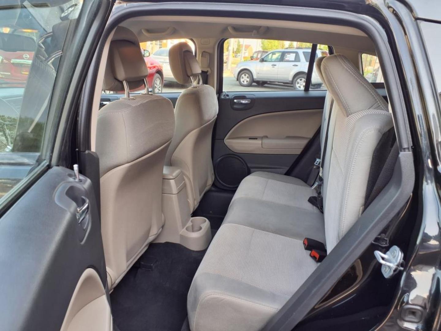 2011 Black Dodge Caliber Mainstreet (1B3CB3HAXBD) with an 2.0L 4 Cylinder Sequential-Port F.I. engine, 4CYL AT transmission, located at 50 Eastern Blvd., Essex, MD, 21221, (410) 686-3444, 39.304367, -76.484947 - Photo#11