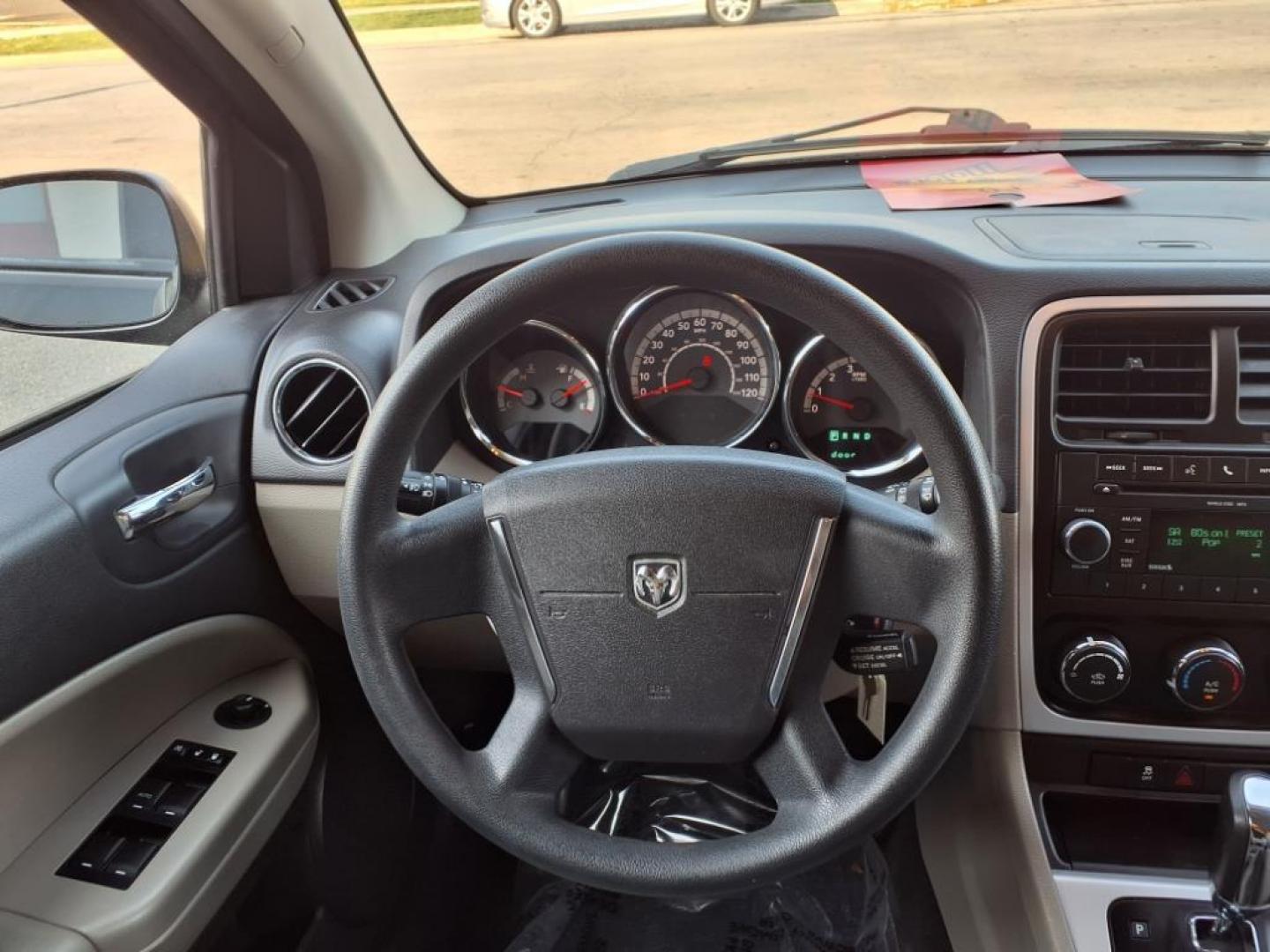 2011 Black Dodge Caliber Mainstreet (1B3CB3HAXBD) with an 2.0L 4 Cylinder Sequential-Port F.I. engine, 4CYL AT transmission, located at 50 Eastern Blvd., Essex, MD, 21221, (410) 686-3444, 39.304367, -76.484947 - Photo#12