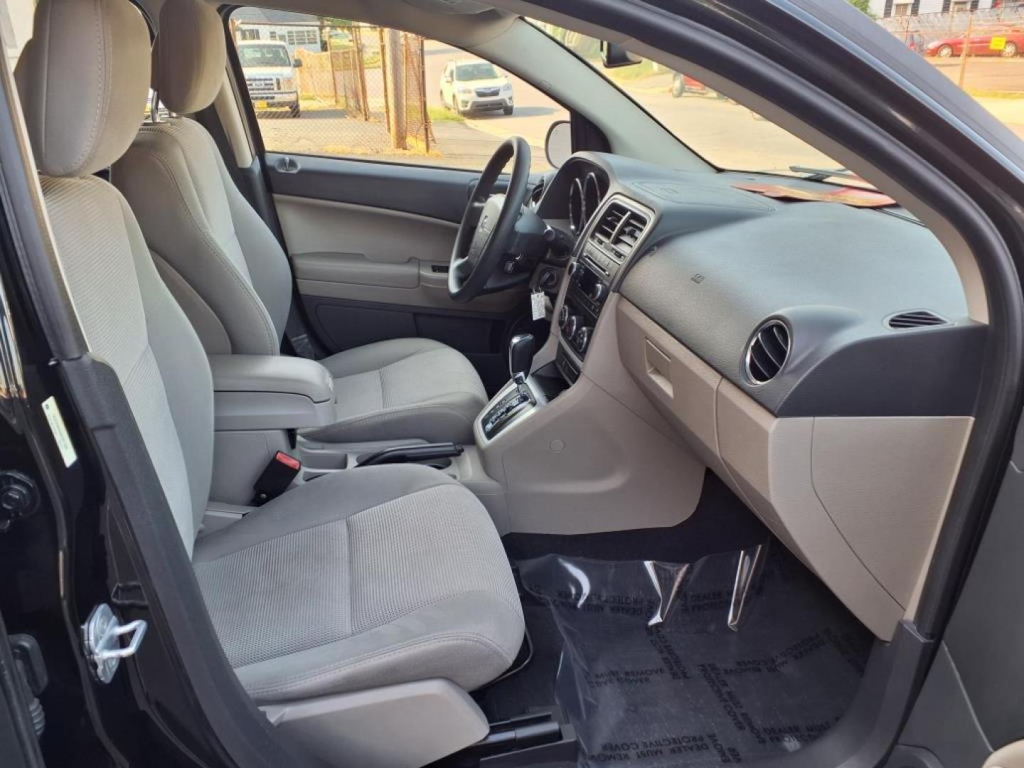 2011 Black Dodge Caliber Mainstreet (1B3CB3HAXBD) with an 2.0L 4 Cylinder Sequential-Port F.I. engine, 4CYL AT transmission, located at 50 Eastern Blvd., Essex, MD, 21221, (410) 686-3444, 39.304367, -76.484947 - Photo#15
