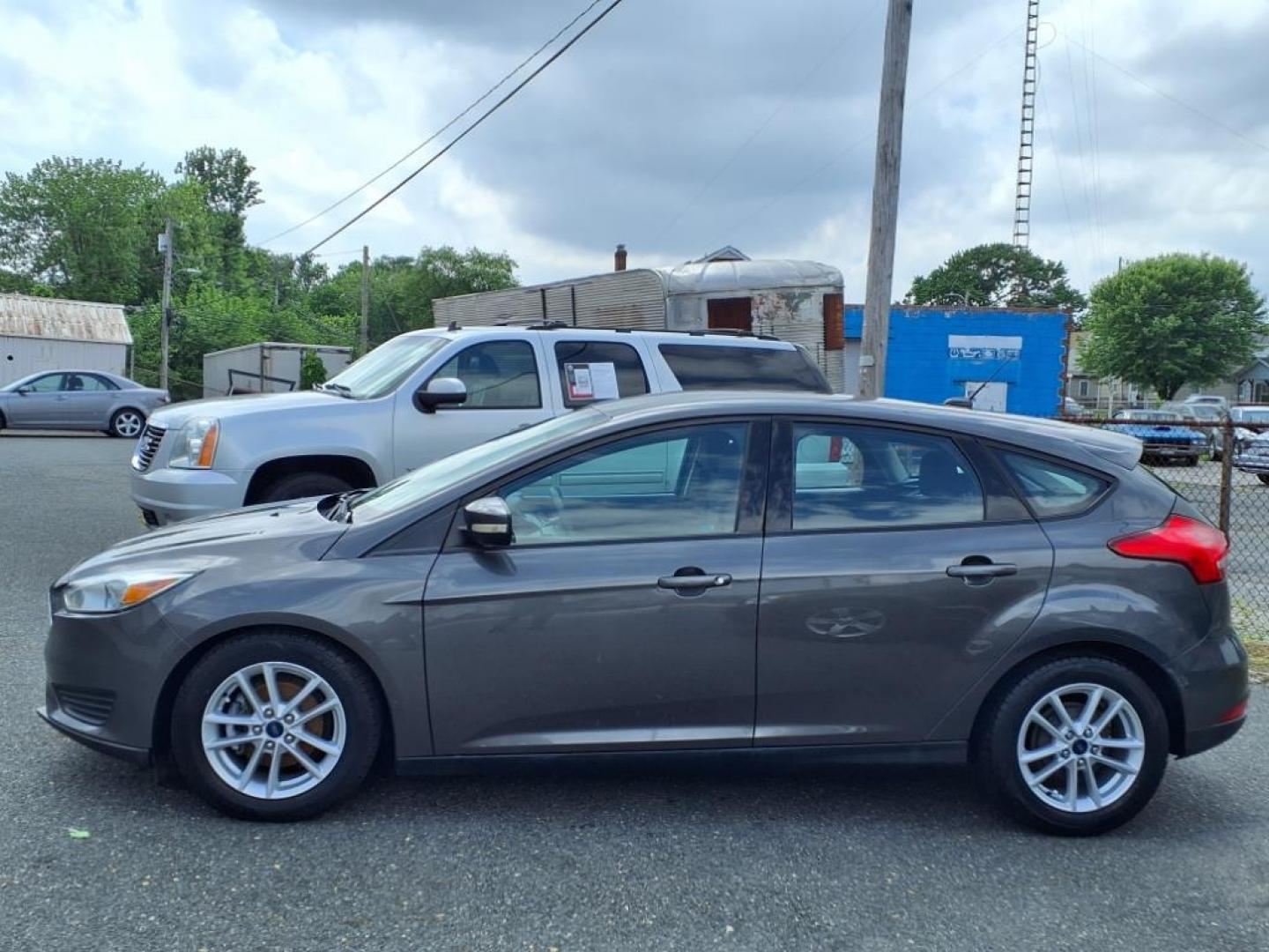 2015 Magnetic Ford Focus SE (1FADP3K26FL) with an 2.0L 4 Cylinder Fuel Injected engine, 4CYL AT transmission, located at 50 Eastern Blvd., Essex, MD, 21221, (410) 686-3444, 39.304367, -76.484947 - Photo#1