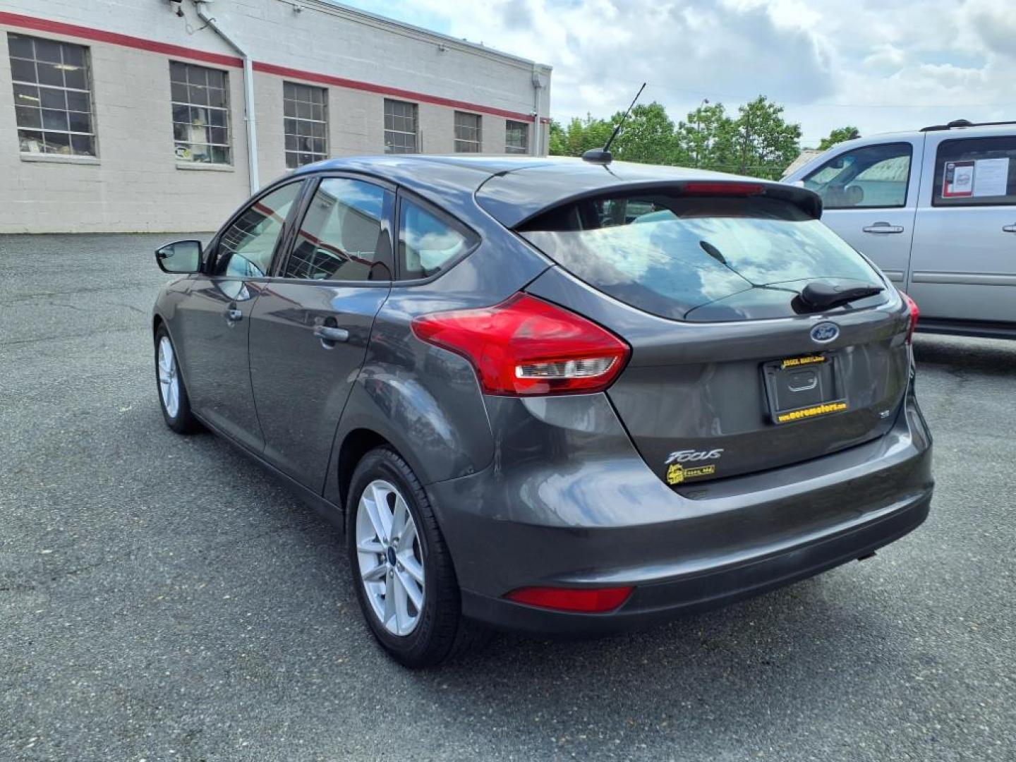 2015 Magnetic Ford Focus SE (1FADP3K26FL) with an 2.0L 4 Cylinder Fuel Injected engine, 4CYL AT transmission, located at 50 Eastern Blvd., Essex, MD, 21221, (410) 686-3444, 39.304367, -76.484947 - Photo#2