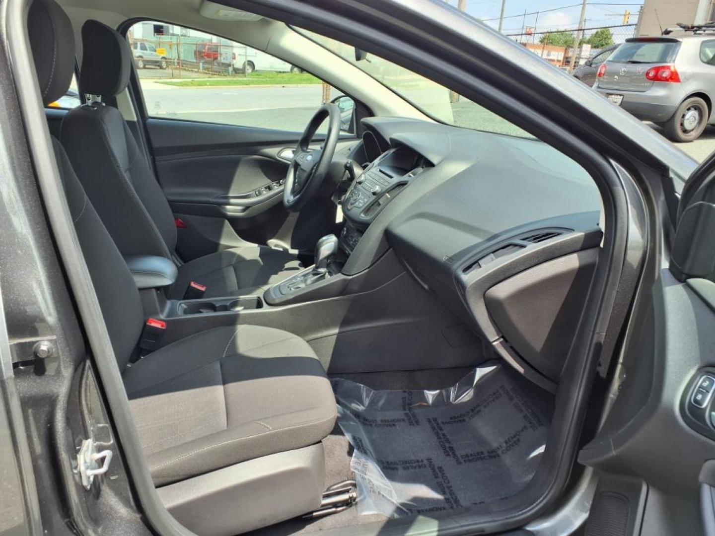 2015 Magnetic Ford Focus SE (1FADP3K26FL) with an 2.0L 4 Cylinder Fuel Injected engine, 4CYL AT transmission, located at 50 Eastern Blvd., Essex, MD, 21221, (410) 686-3444, 39.304367, -76.484947 - Photo#16