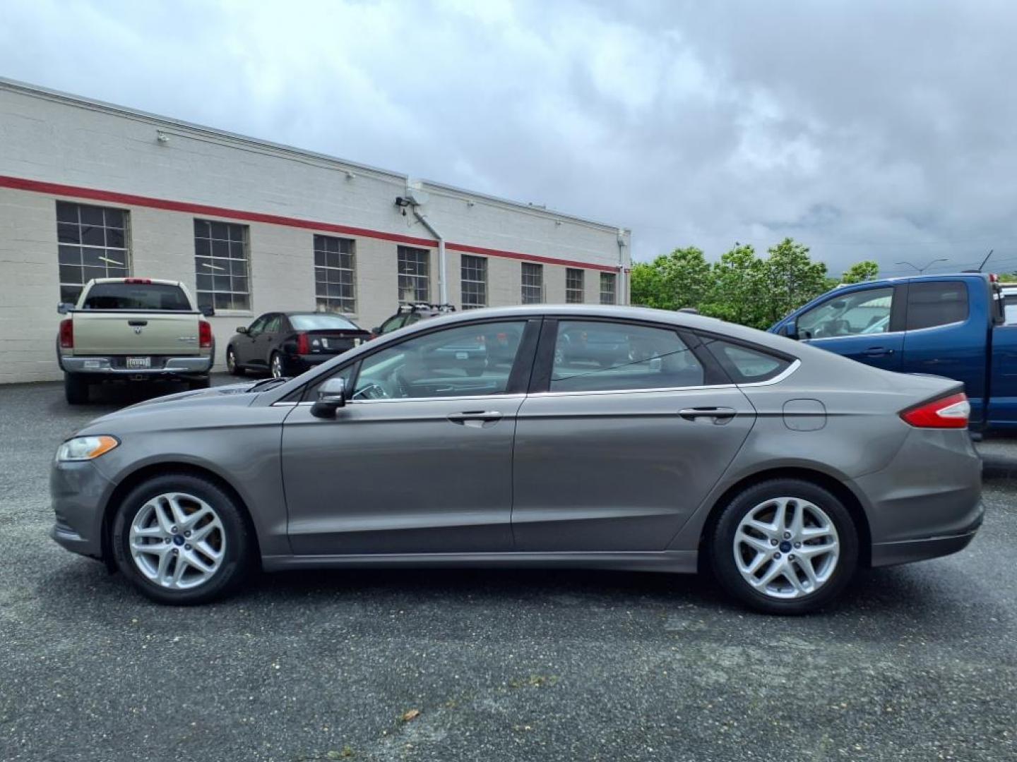 2014 Sterling Gray Metallic Ford Fusion SE (1FA6P0H79E5) with an 2.5L 4 Cylinder Sequential-Port F.I. engine, 4CYL transmission, located at 50 Eastern Blvd., Essex, MD, 21221, (410) 686-3444, 39.304367, -76.484947 - Photo#1