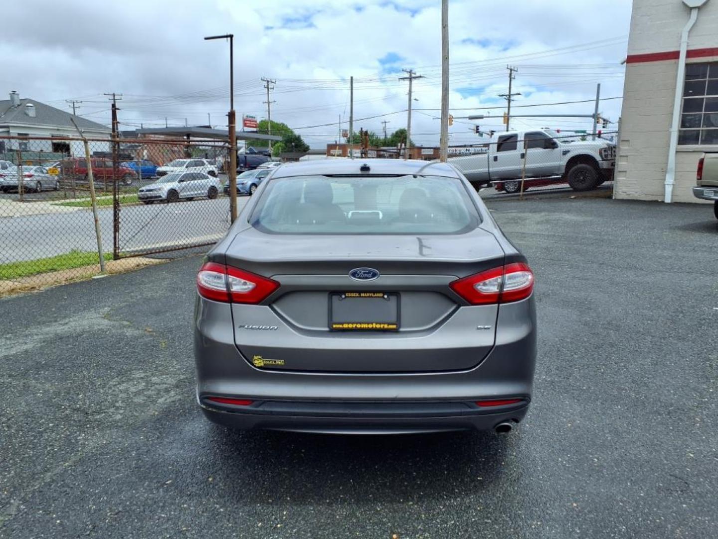 2014 Sterling Gray Metallic Ford Fusion SE (1FA6P0H79E5) with an 2.5L 4 Cylinder Sequential-Port F.I. engine, 4CYL transmission, located at 50 Eastern Blvd., Essex, MD, 21221, (410) 686-3444, 39.304367, -76.484947 - Photo#2