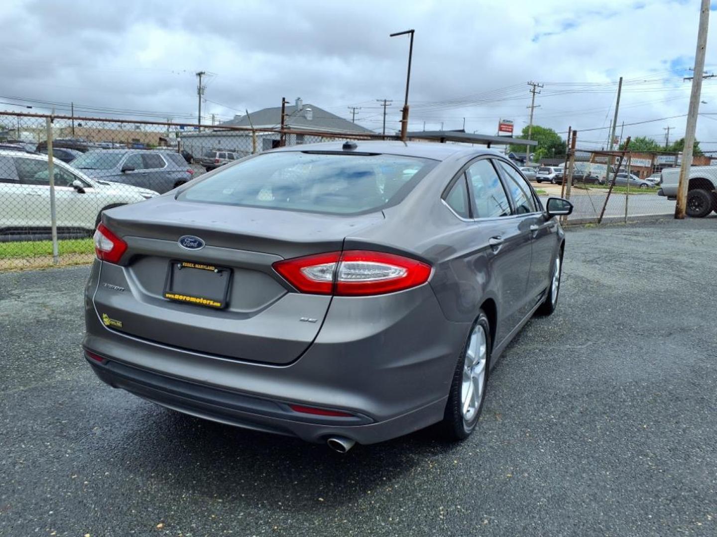 2014 Sterling Gray Metallic Ford Fusion SE (1FA6P0H79E5) with an 2.5L 4 Cylinder Sequential-Port F.I. engine, 4CYL transmission, located at 50 Eastern Blvd., Essex, MD, 21221, (410) 686-3444, 39.304367, -76.484947 - Photo#3