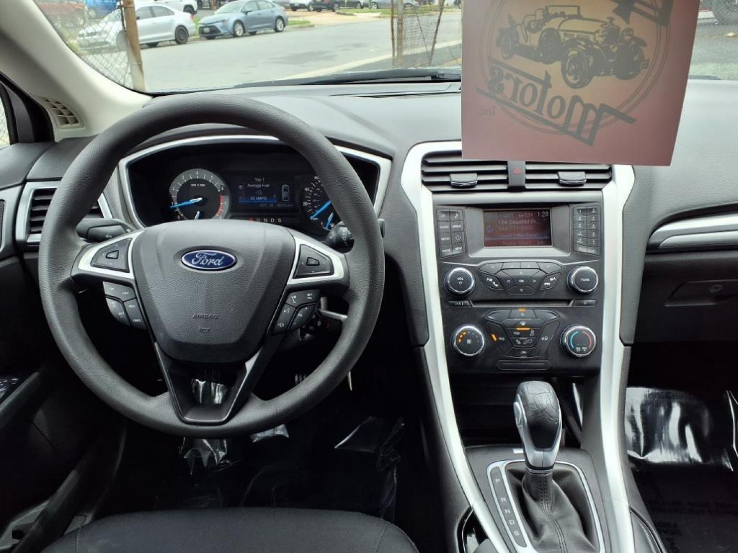 2014 Sterling Gray Metallic Ford Fusion SE (1FA6P0H79E5) with an 2.5L 4 Cylinder Sequential-Port F.I. engine, 4CYL transmission, located at 50 Eastern Blvd., Essex, MD, 21221, (410) 686-3444, 39.304367, -76.484947 - Photo#12