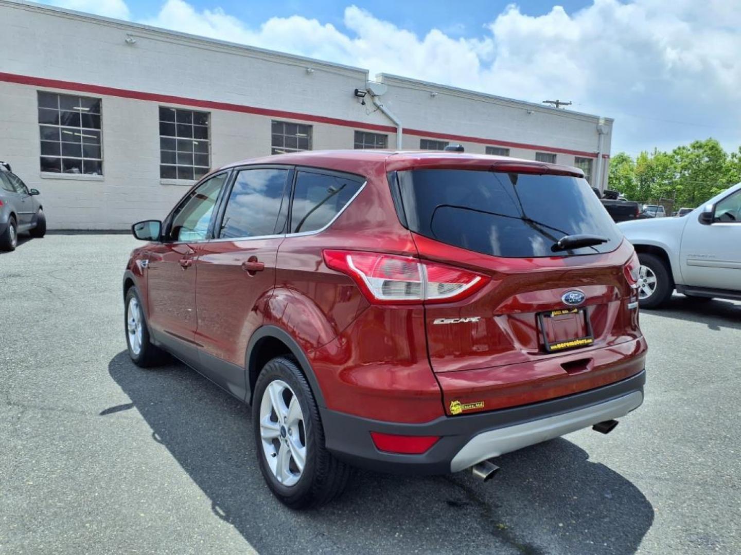 2014 Ruby Red Metallic Tinted Clearcoat Ford Escape SE (1FMCU0GX1EU) with an 1.6L 4 Cylinder Turbocharged engine, V6 AT transmission, located at 50 Eastern Blvd., Essex, MD, 21221, (410) 686-3444, 39.304367, -76.484947 - Photo#2
