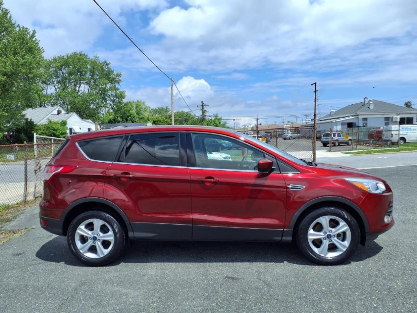 2014 Ruby Red Metallic Tinted Clearcoat Ford Escape SE (1FMCU0GX1EU) with an 1.6L 4 Cylinder Turbocharged engine, V6 AT transmission, located at 50 Eastern Blvd., Essex, MD, 21221, (410) 686-3444, 39.304367, -76.484947 - Photo#6