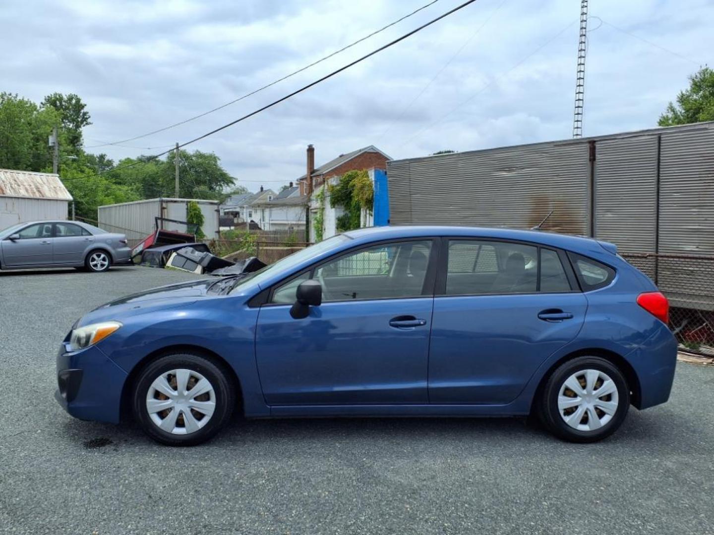 2012 Marine Blue Pearl Subaru Impreza 2.0i (JF1GPAA67CH) with an 2.0L 2.0L H4 148hp 145ft. lbs. Sequential-Port F.I. engine, CVT transmission, located at 50 Eastern Blvd., Essex, MD, 21221, (410) 686-3444, 39.304367, -76.484947 - Photo#1