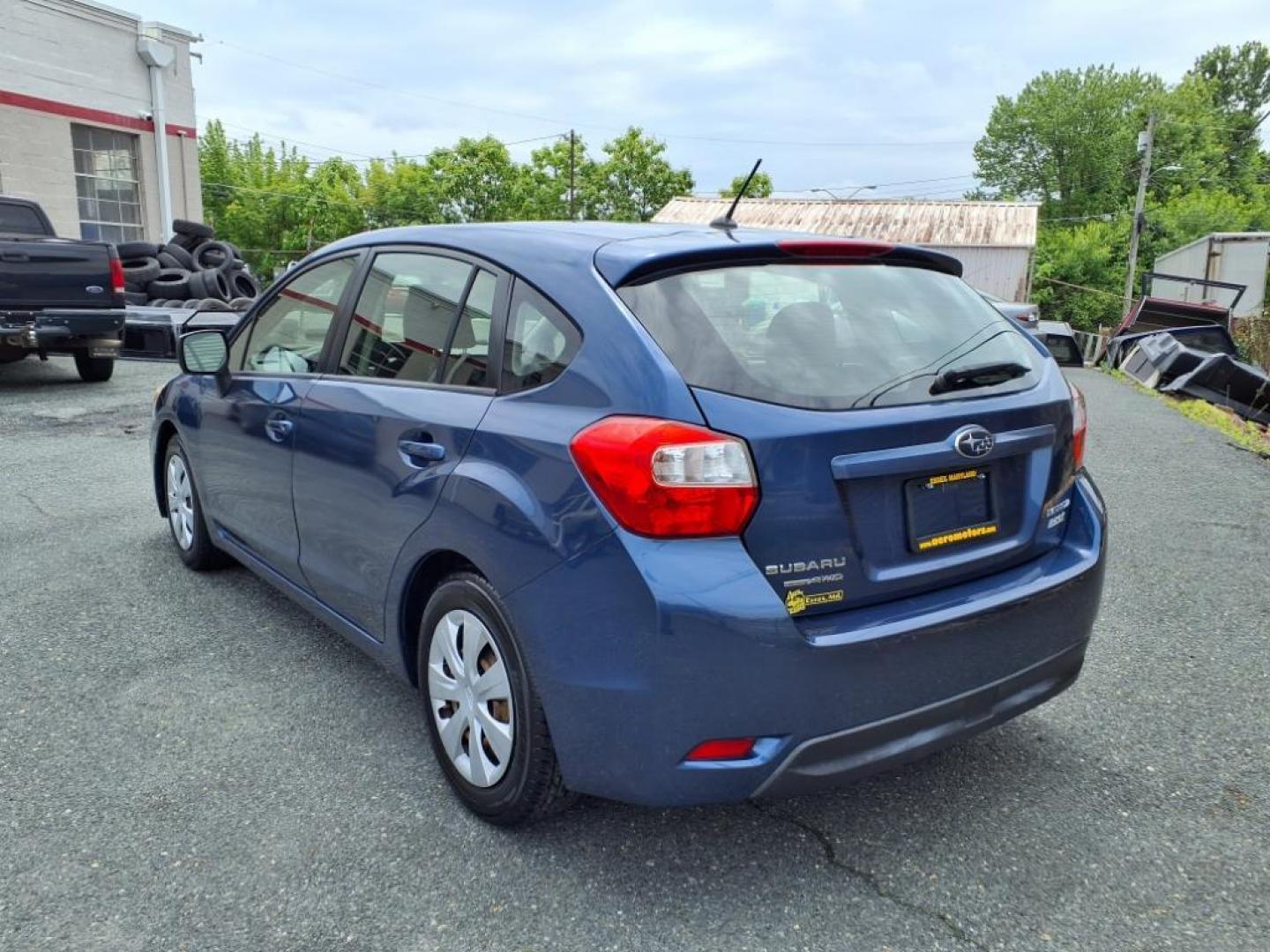 2012 Marine Blue Pearl Subaru Impreza 2.0i (JF1GPAA67CH) with an 2.0L 2.0L H4 148hp 145ft. lbs. Sequential-Port F.I. engine, CVT transmission, located at 50 Eastern Blvd., Essex, MD, 21221, (410) 686-3444, 39.304367, -76.484947 - Photo#2