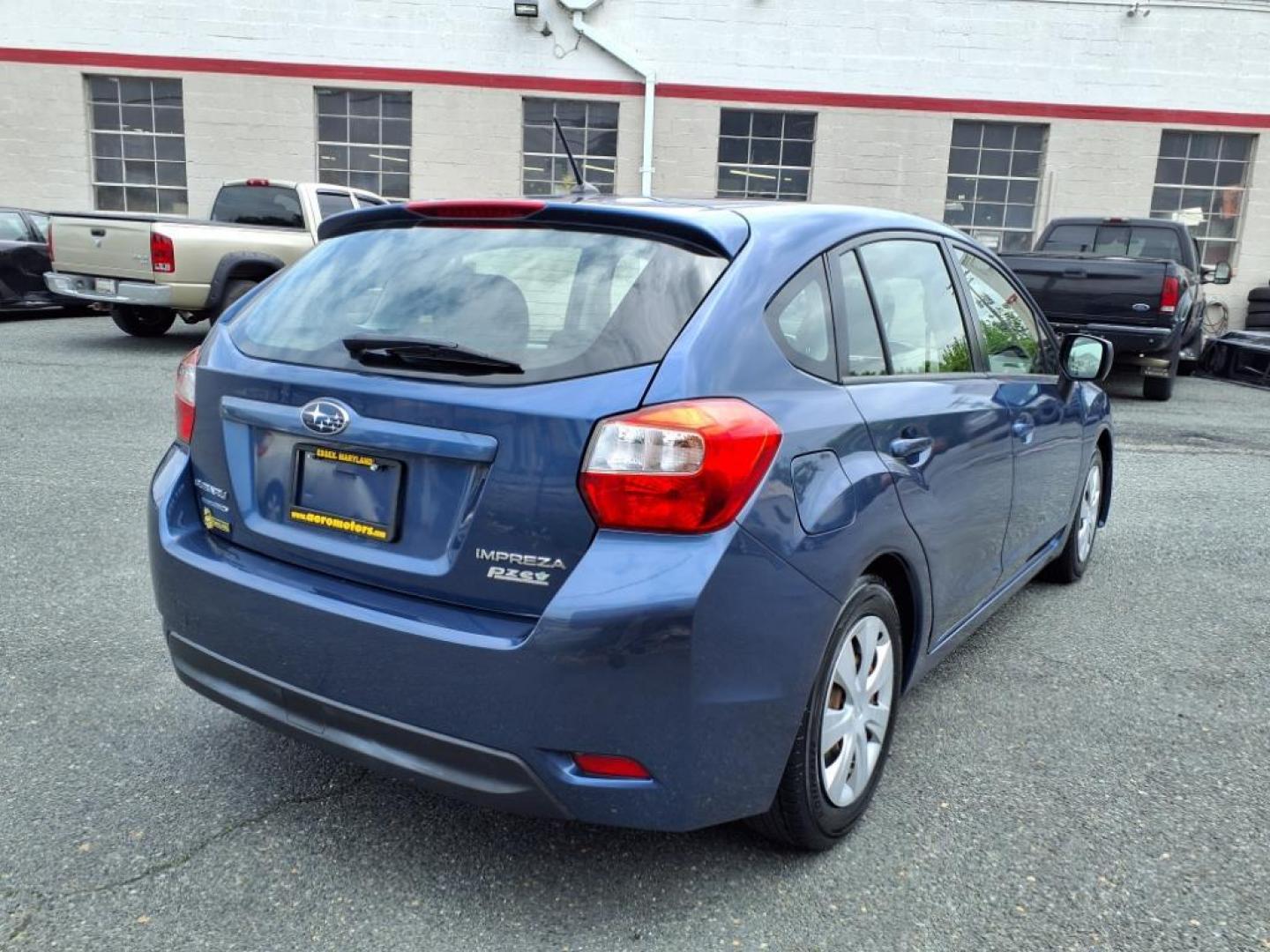2012 Marine Blue Pearl Subaru Impreza 2.0i (JF1GPAA67CH) with an 2.0L 2.0L H4 148hp 145ft. lbs. Sequential-Port F.I. engine, CVT transmission, located at 50 Eastern Blvd., Essex, MD, 21221, (410) 686-3444, 39.304367, -76.484947 - Photo#5